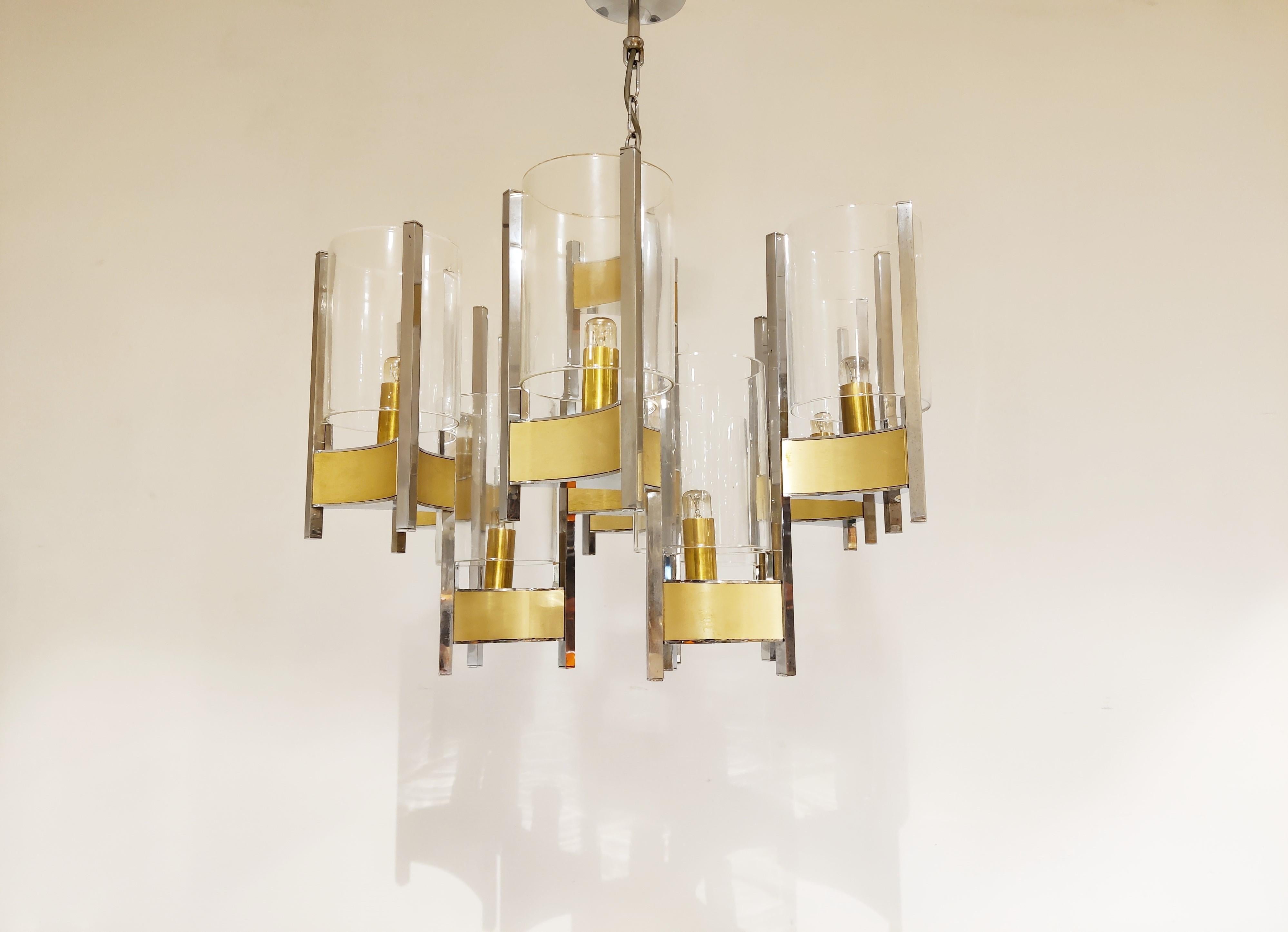 Beautiful 'hurricane' chandelier by Gaetano Sciolari with 8 lightpoints/glasses

Stunning timeless design that emits a beautiful light.

It can be used with regular E14 candle light bulbs.

1970s - Italy

tested and ready to