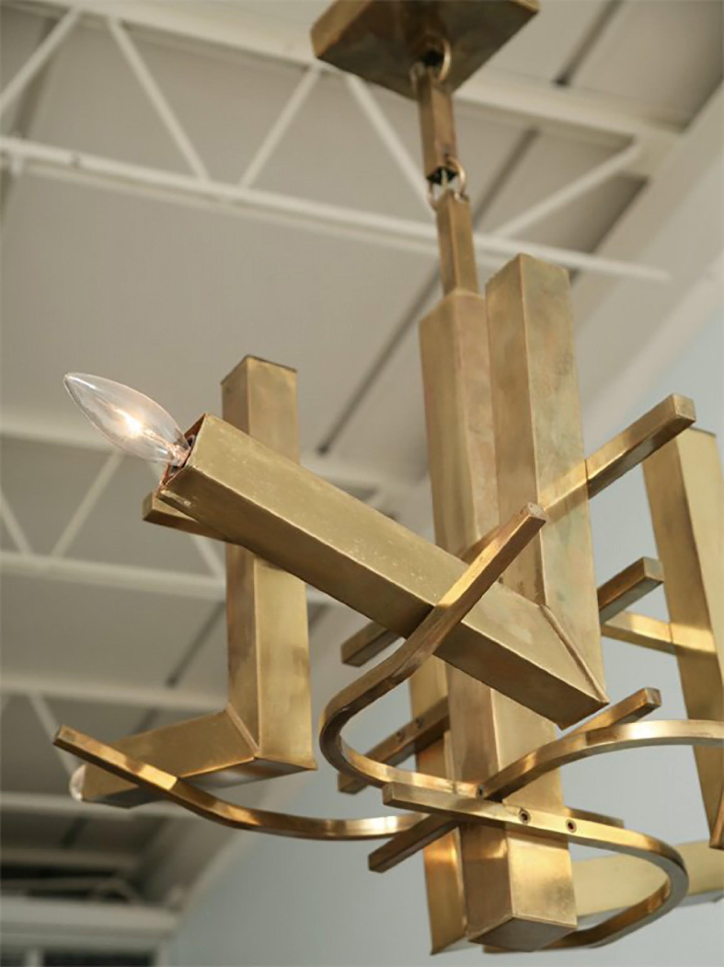 Lampadario italiano a otto luci in ottone di forma geometrica (Gaetano Sciolari) (pezzo simile in legno e ottone: REG5293A)

Condit: Buono; Usura coerente con l'età e l'utilizzo
