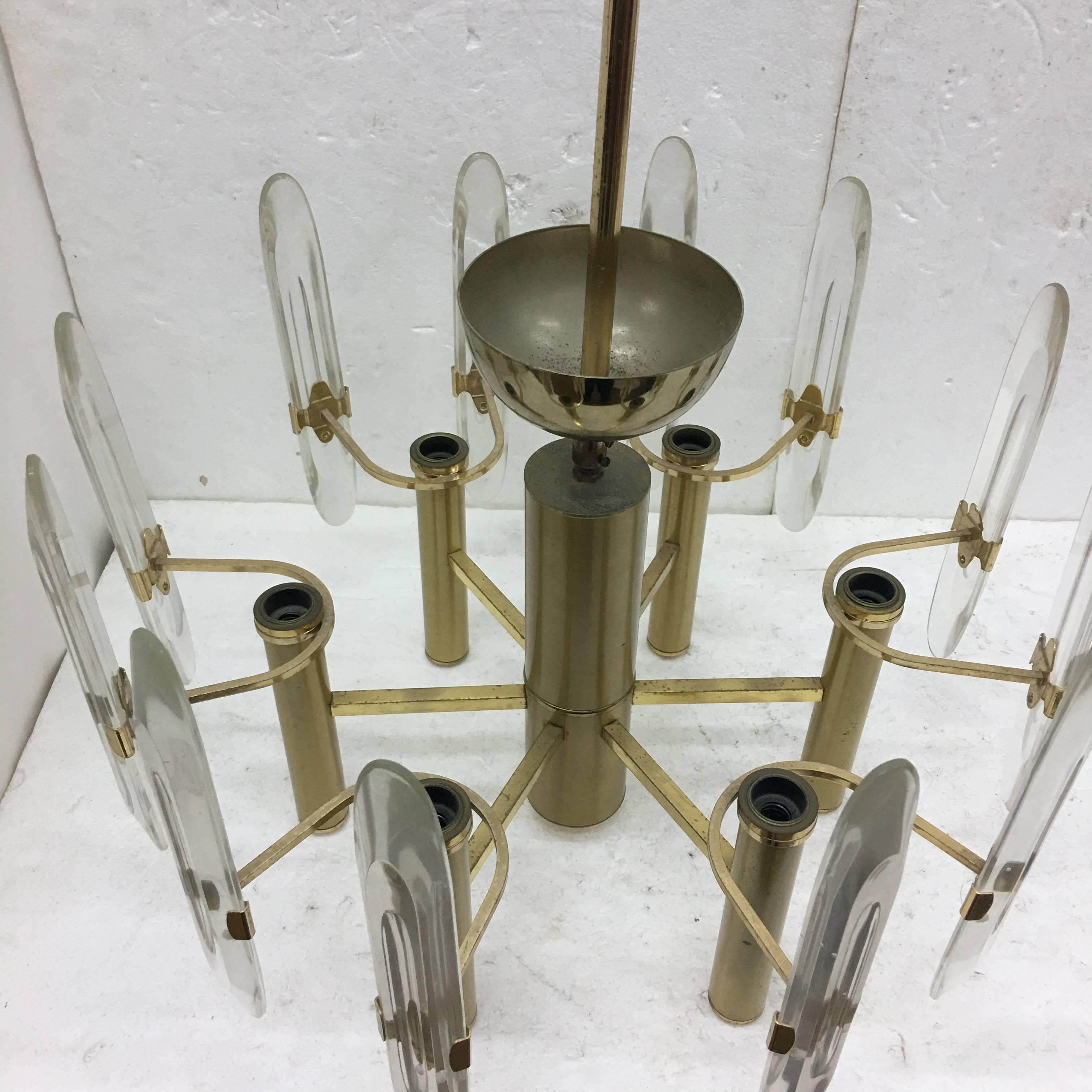 Six-lights chandelier by Gaetano Sciolari, made in Italy in circa 1960, gold metal and optical crystal glass. It works with both 110 and 220 Volts and need regular e14 bulbs.
