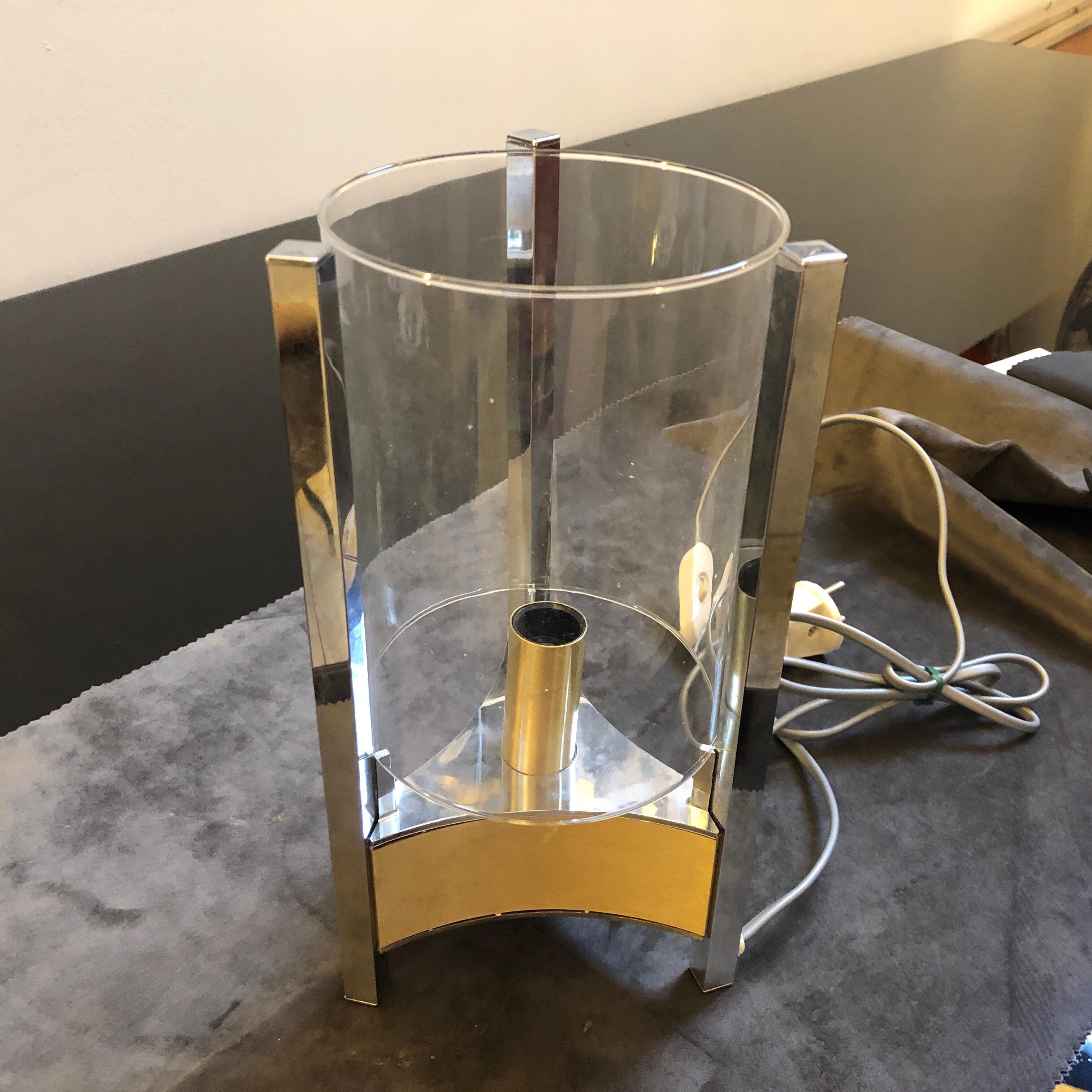 A rare table lamp designed by Gaetano Sciolari and manufactured by Sciolari Lighting in Rome. It's in chrome brass and glass, all parts are in perfect conditions. It's labeled Sciolari on the bottom, it works both 110-240 volts and it needs regular