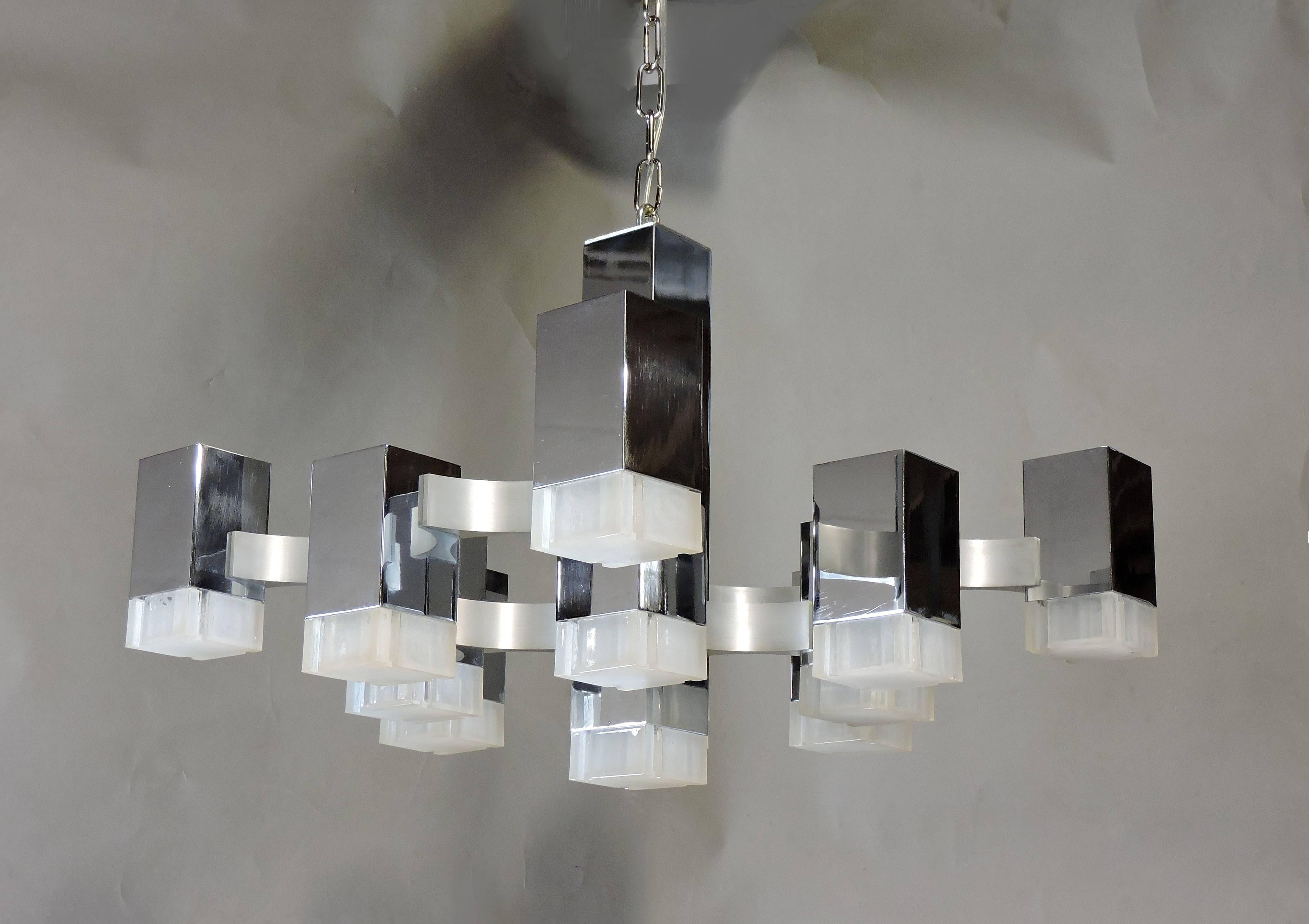 Beautiful Mid-Century Modern Cubic chandelier designed by Gaetano Sciolari and made in Italy for high quality lighting manufacturer, Lightolier. This chandelier consists of thirteen rectangular polished chrome cubes with Lucite shades. The hanging