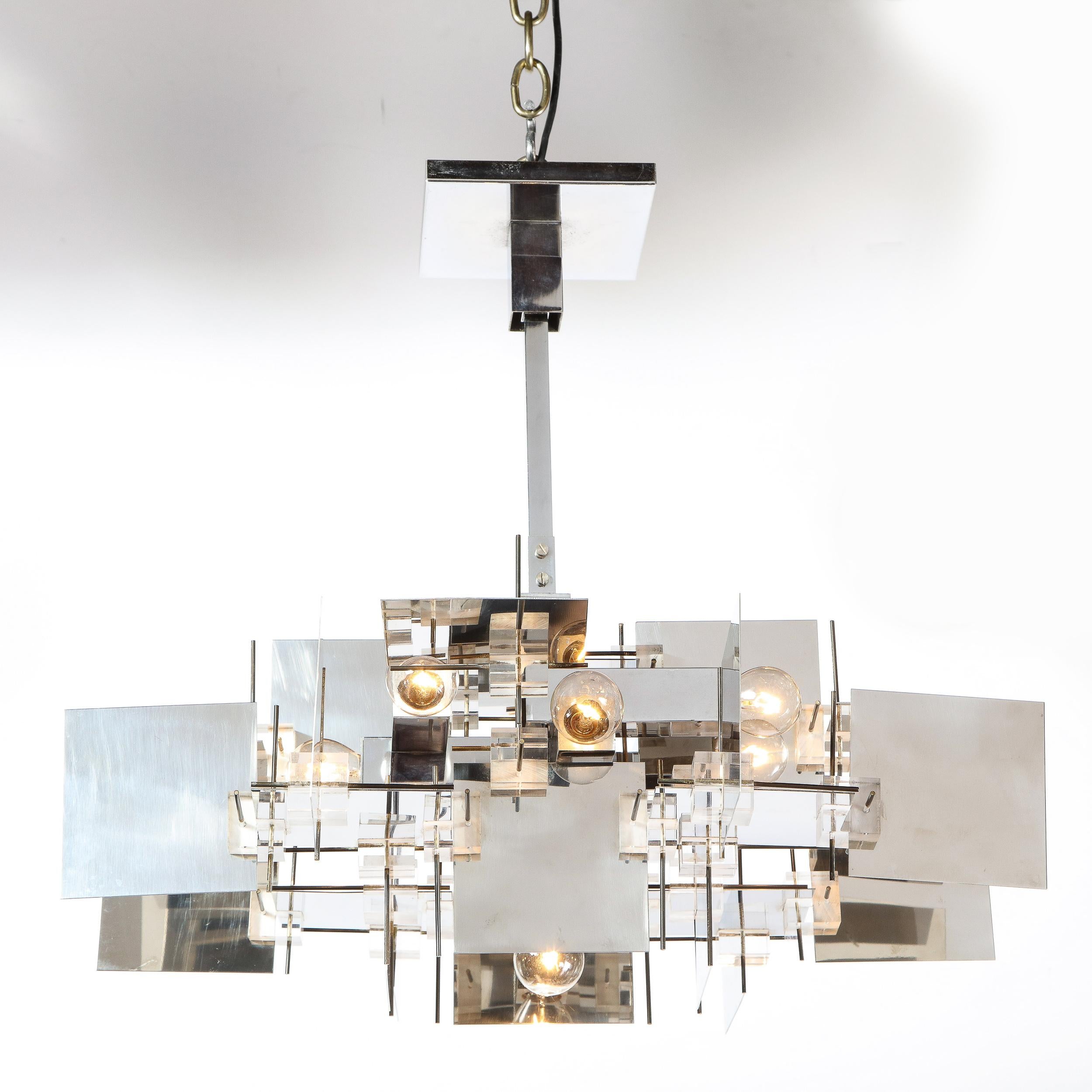 This striking Mid-Century Modern cubist chandelier was realized by the fabled atelier of Gaetano Sciolari in Italy, circa 1970. It features intersecting square planes of lustrous polished chrome interspersed with volumetric cubes of translucent