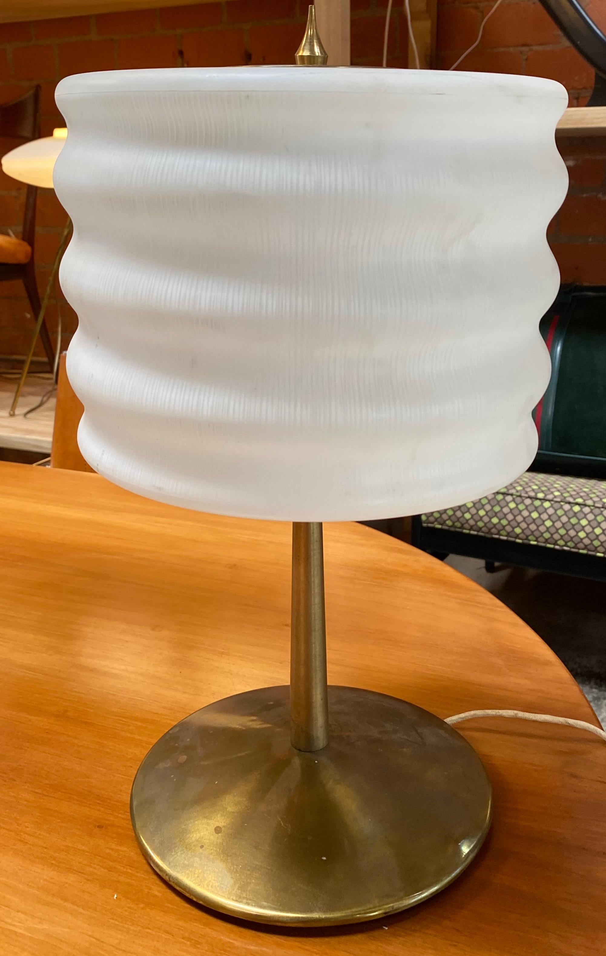 A brass and glass table lamp designed and manufactured by Gaetano Sciolari, name impressed on the bottom. Brass and glass in original patina, circa 1970.