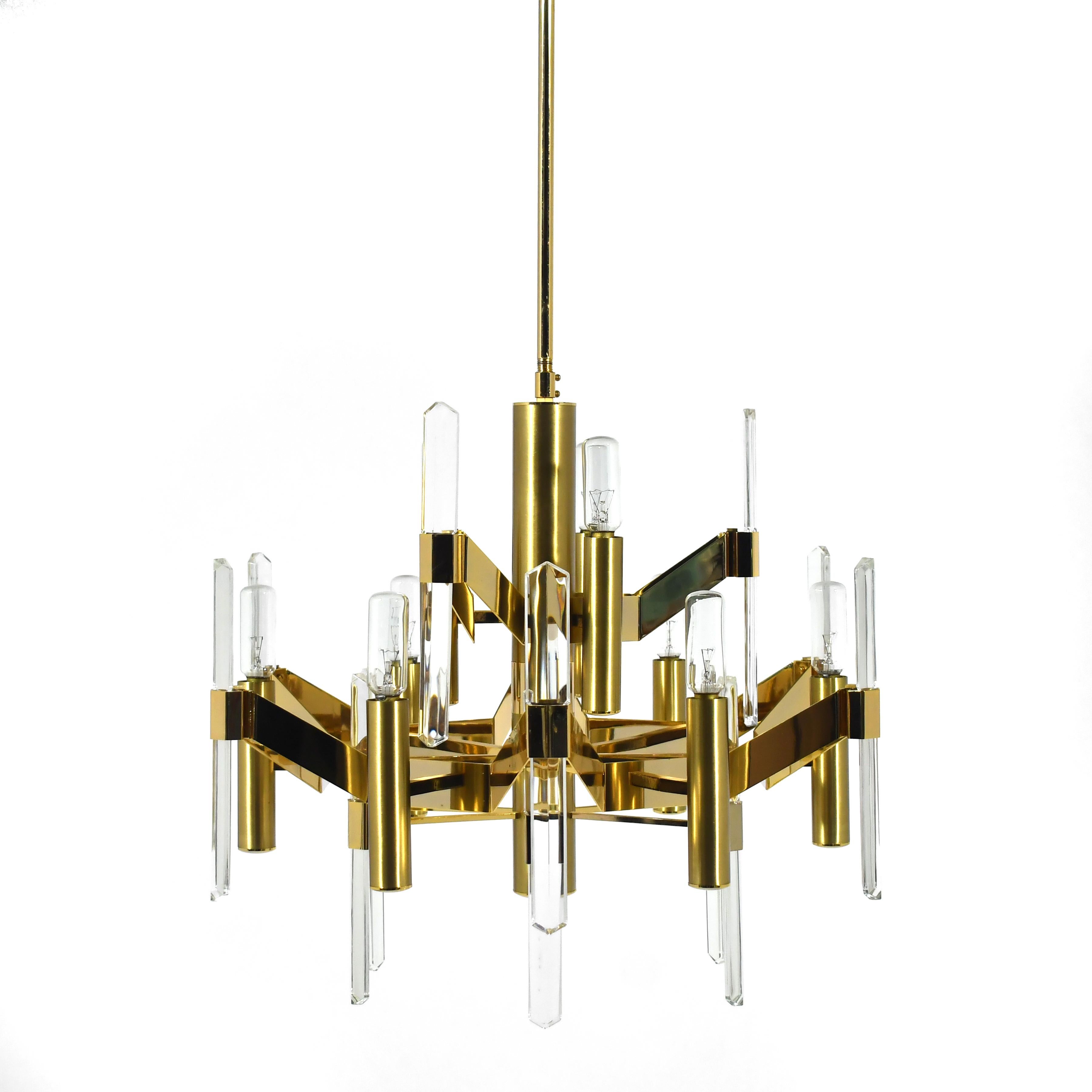 A stunning example of Sciolari's elegant aesthetic, this chandelier combines rich brass and brass colored aluminum with beveled crystal 