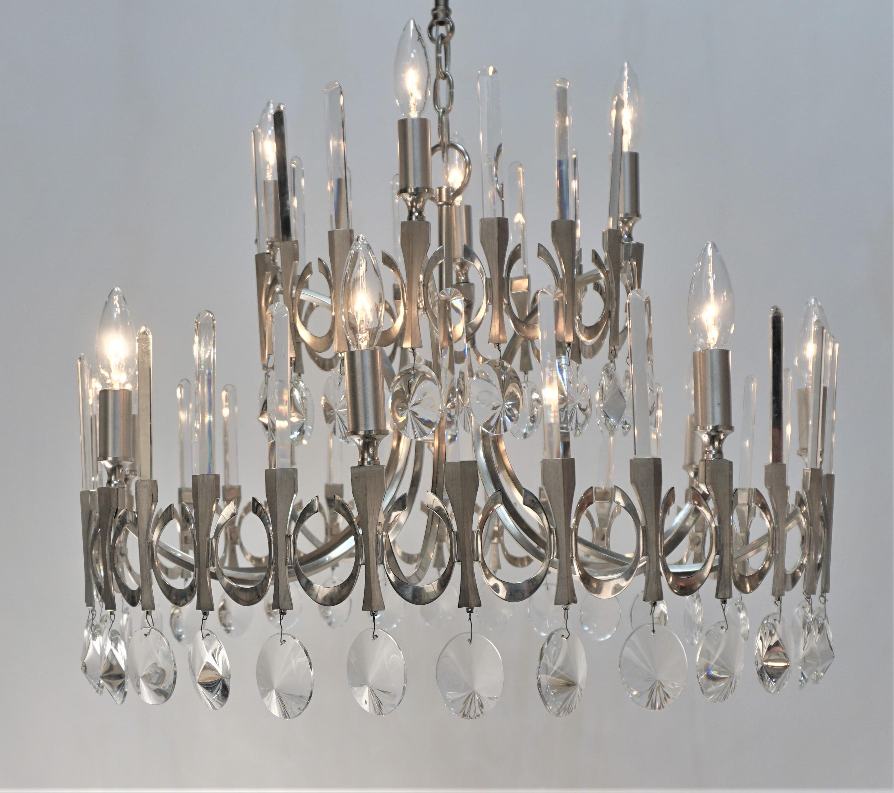 Beautiful 1970's modern with classical design silverplate on bronze and crystal chandelier.