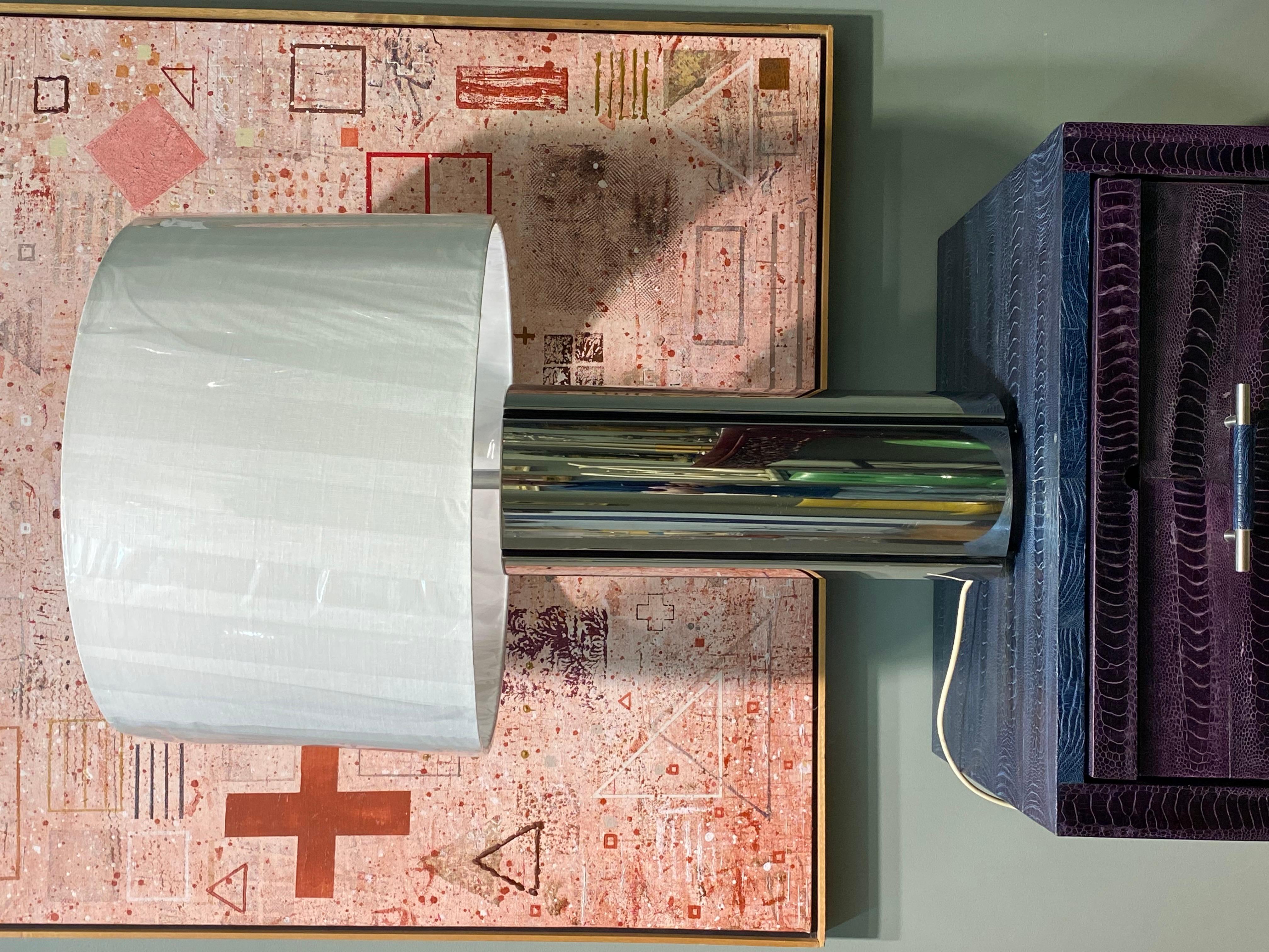 Gaetano Sciolari’s designs are renowned for their modernist aesthetic, and this lamp certainly embodies that. The combination of chrome and black enamel, along with its substantial height, would make it a standout in any room. The hollow chrome