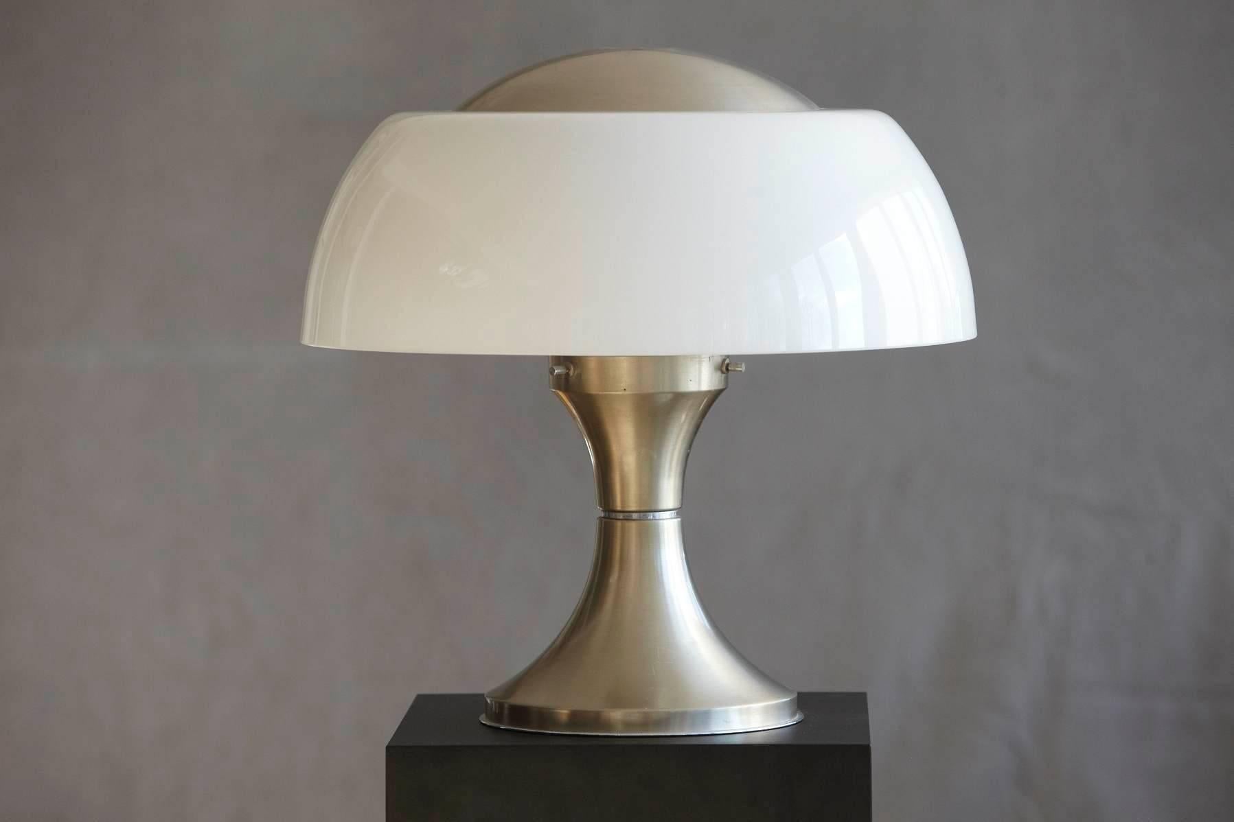 Chromed steel table lamp base with a mat finish and an internal opaline glass diffuser and a perspex lampshade, designed by Gaetano Sciolari for Ecolight formerly Valenti, 1968.
The base has a tiny dent, please refer to the photos, otherwise in