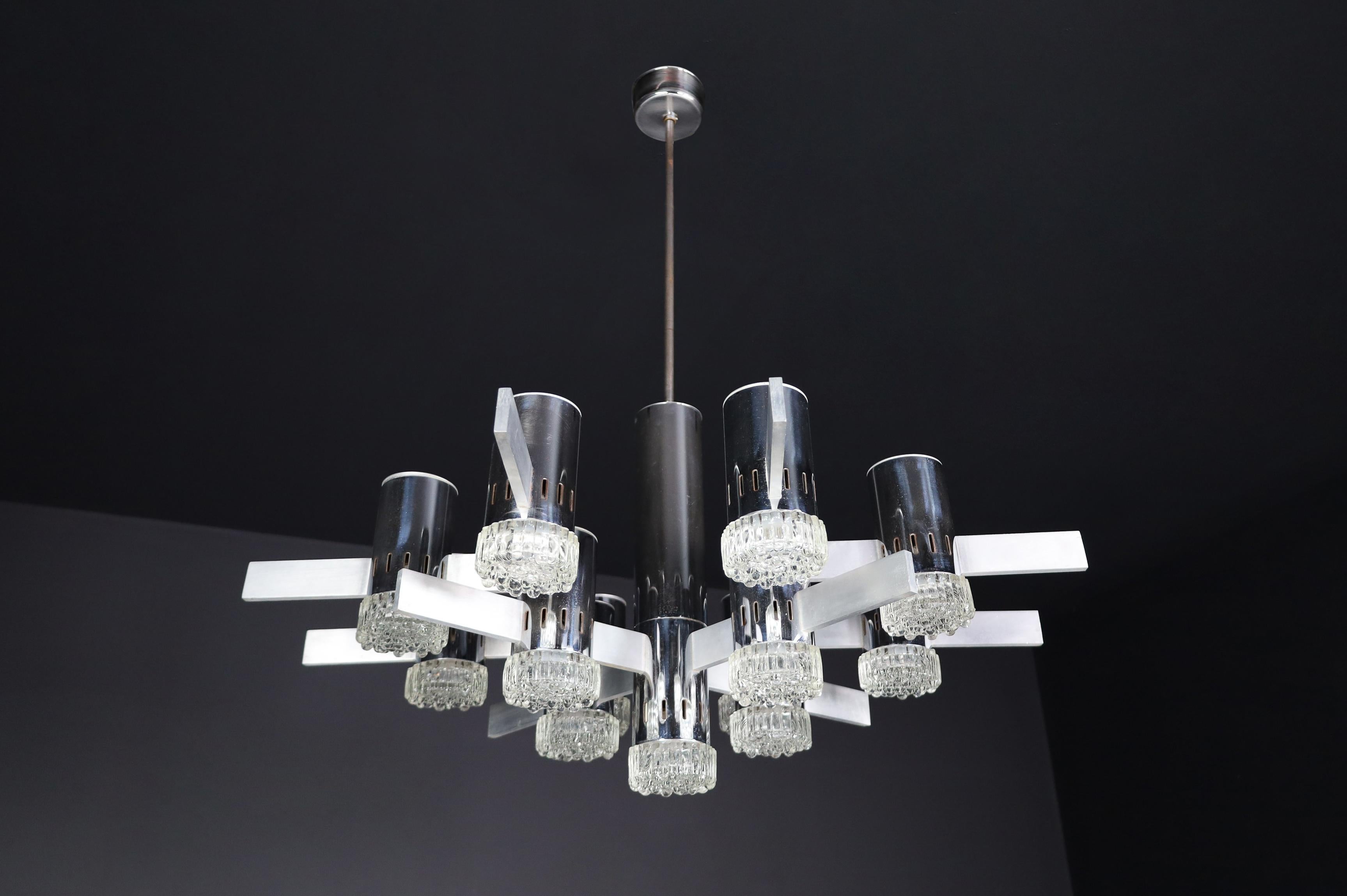  Gaetano Sciolari XXl Chandelier with chrome and aluminium fixture, Italy, circa 1970s

This is an impressive chandelier designed by Angelo Gaetano Sciolari in Italy during the 1970s. This large chandelier features 11 lights, combining chrome and