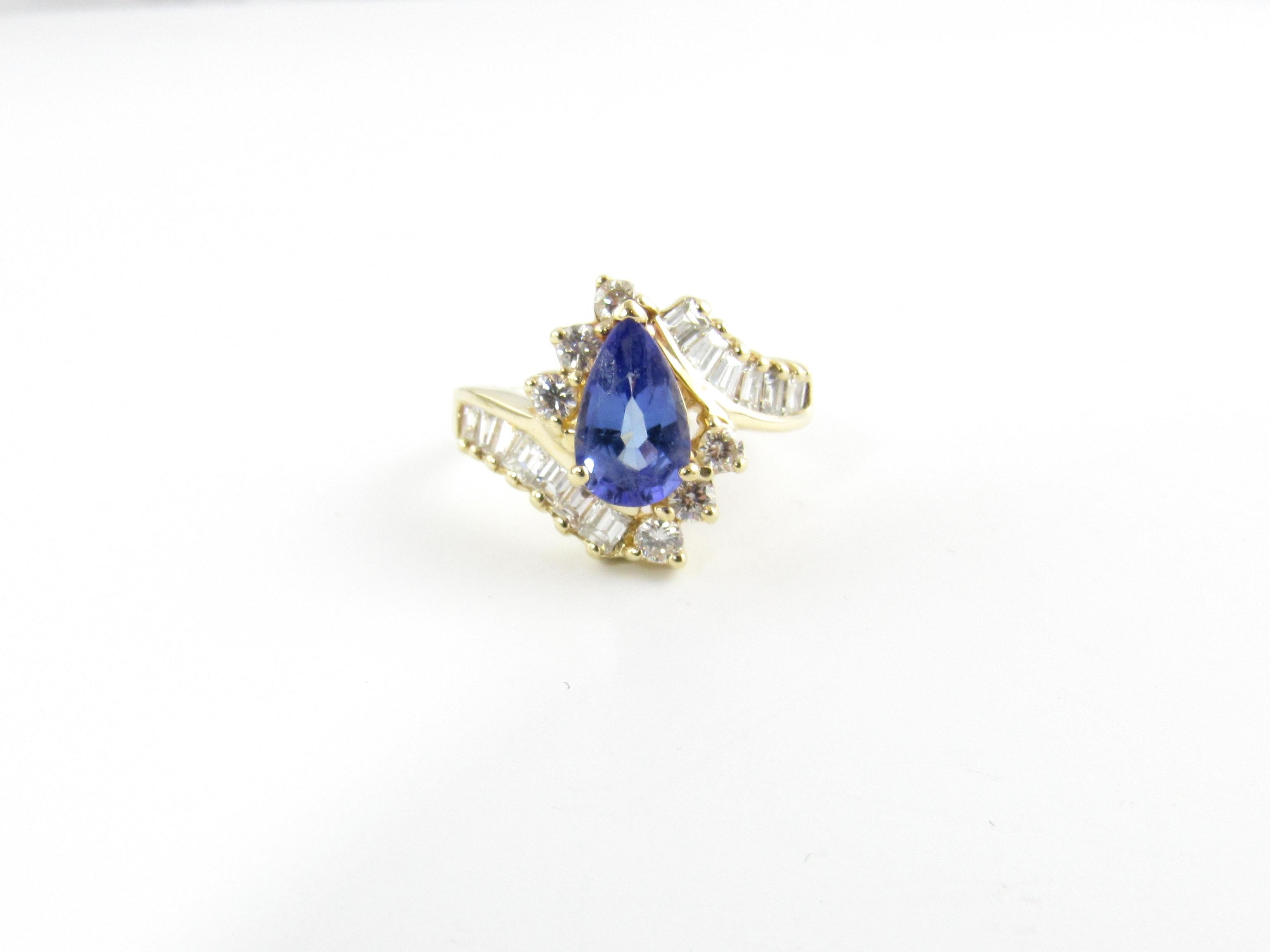14 Karat Yellow Gold Tanzanite and Diamond Ring Size 6

This stunning ring features one pear-shaped tanzanite (10 mm x 6 mm), six baguette diamonds (1.10 TCW) and six round brilliant cut diamonds (.24 TCW) set in beautifully detailed 14K yellow
