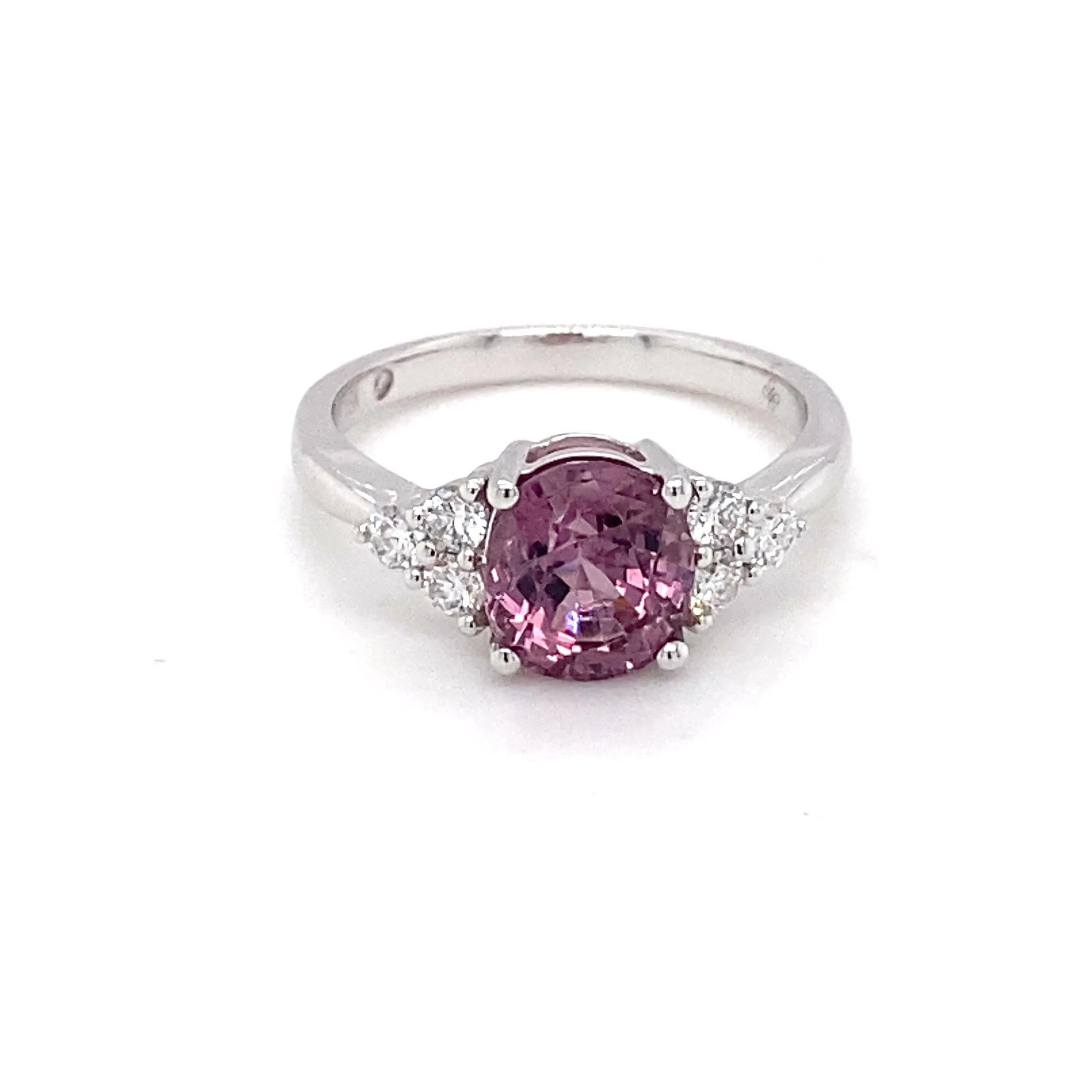 This beautiful ring has purple spinel as the center stone with accent diamonds on the shank. Crafted in 18K white gold symbolizes luxury and grace. Perfect for all occasions.
Weight of Spinel: 2.40 Carat
Weight of Diamond: 0.368 Carat
Gold: 18K