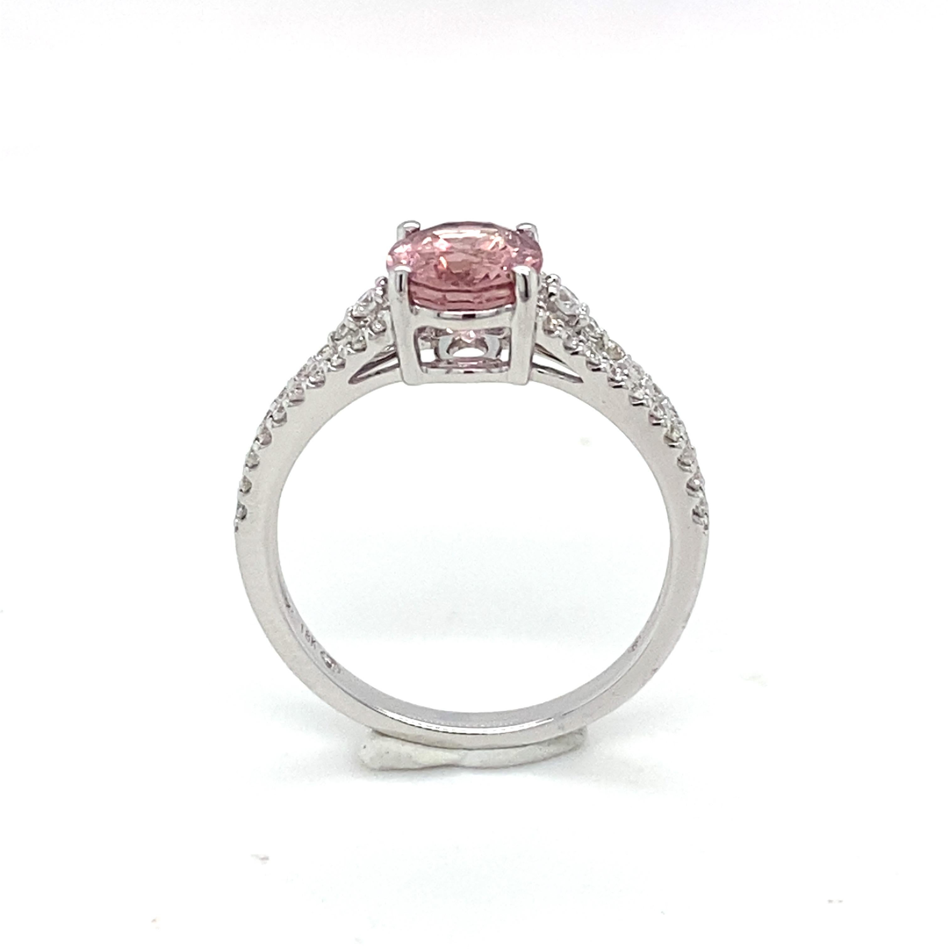 This pink oval spinel ring set in prongs is adorned with two rows of diamonds on the shank. Crafted in 18K white gold symbolizes luxury and grace. Perfect for all occasions.
Weight of Spinel: 1.69 Carat
Weight of Diamond: 0.319 Carat
Gold: 18K