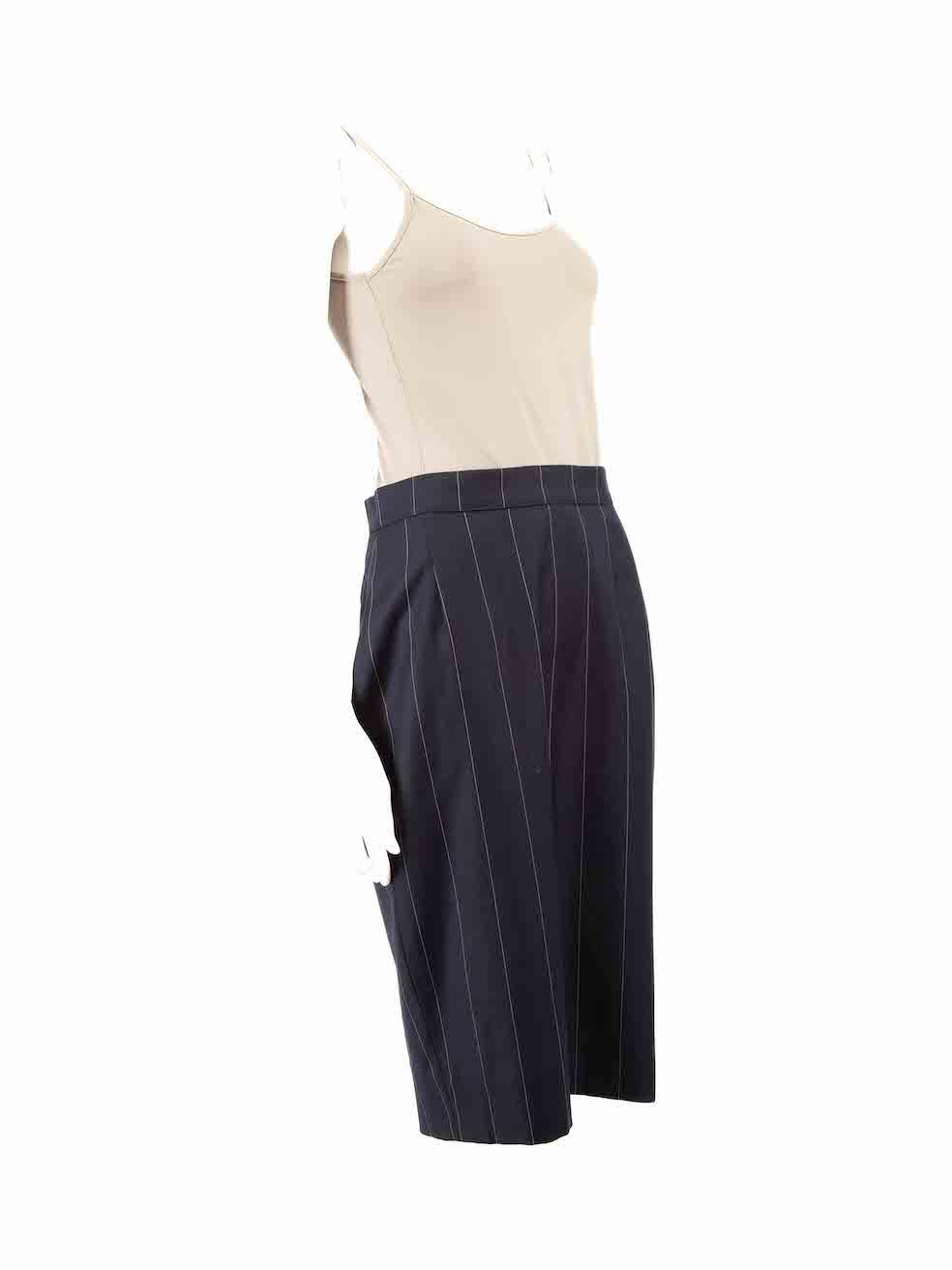 CONDITION is Very good. Hardly any visible wear to skirt is evident on this used Gai Mattiolo designer resale item.
 
 
 
 Details
 
 
 Navy
 
 Wool
 
 Skirt
 
 Pinstripe pattern
 
 Knee length
 
 Straight fit
 
 Back zip and button fastening
 
 
 

