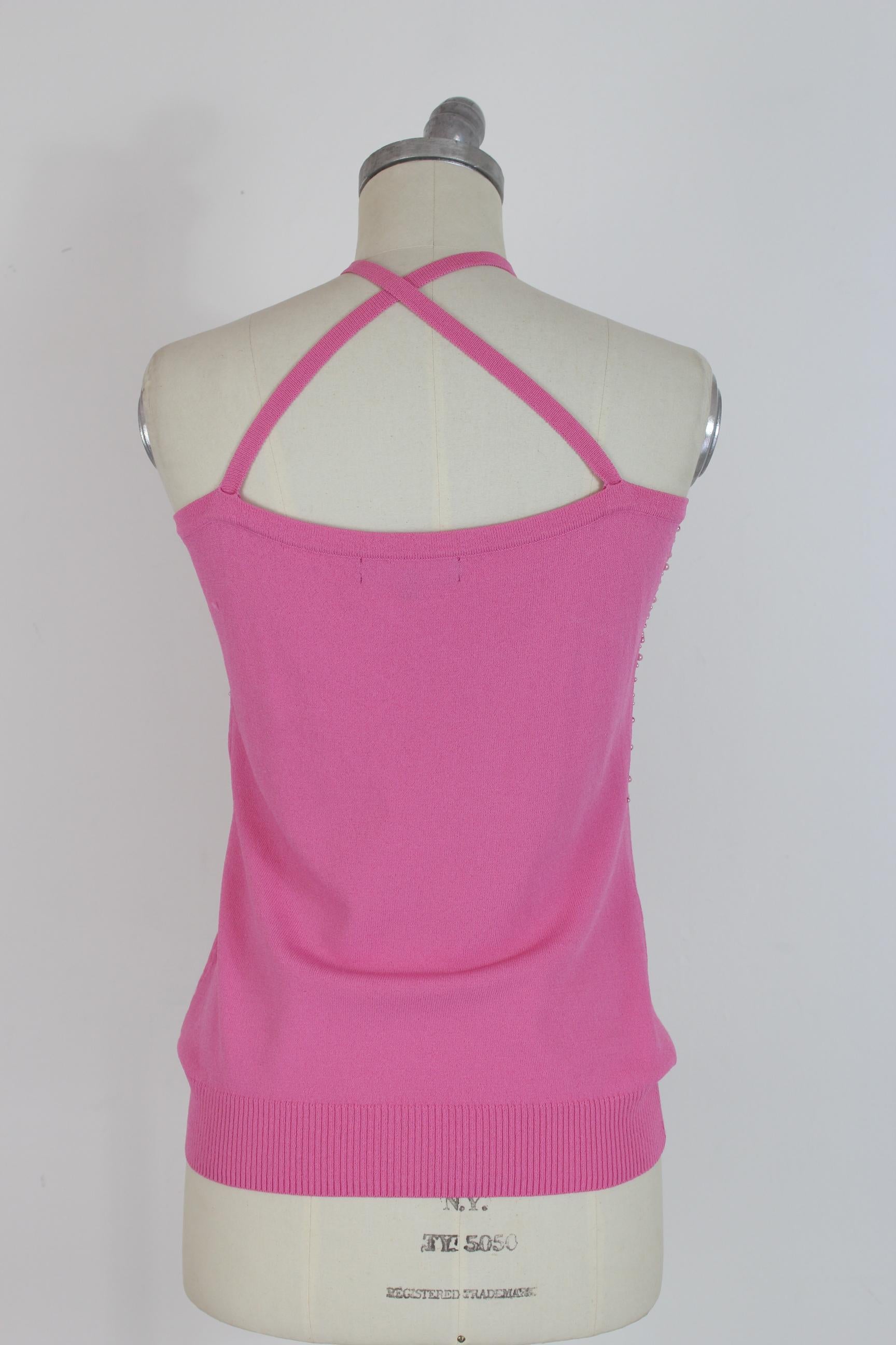 Gai Mattiolo elegant 90s vintage women's shirt. Evening top with beaded applications, pink color. 65% rayon, 35% nylon. Excellent vintage conditions.

Size: 46 It 12 Us 14 Uk

Shoulder: 44 cm

Bust / Chest: 46 cm

Length: 44 cm