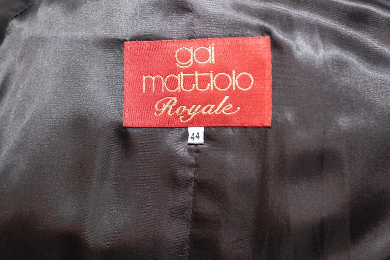 Elegant wool coat designed by stylist Gai Mattiolo in the 1990s, fine Italian manufacture.
The coat is made entirely of brown wool, which is warm and cosy. It has long sleeves and its length reaches mid-thigh.
The coat has a short, raised collar,