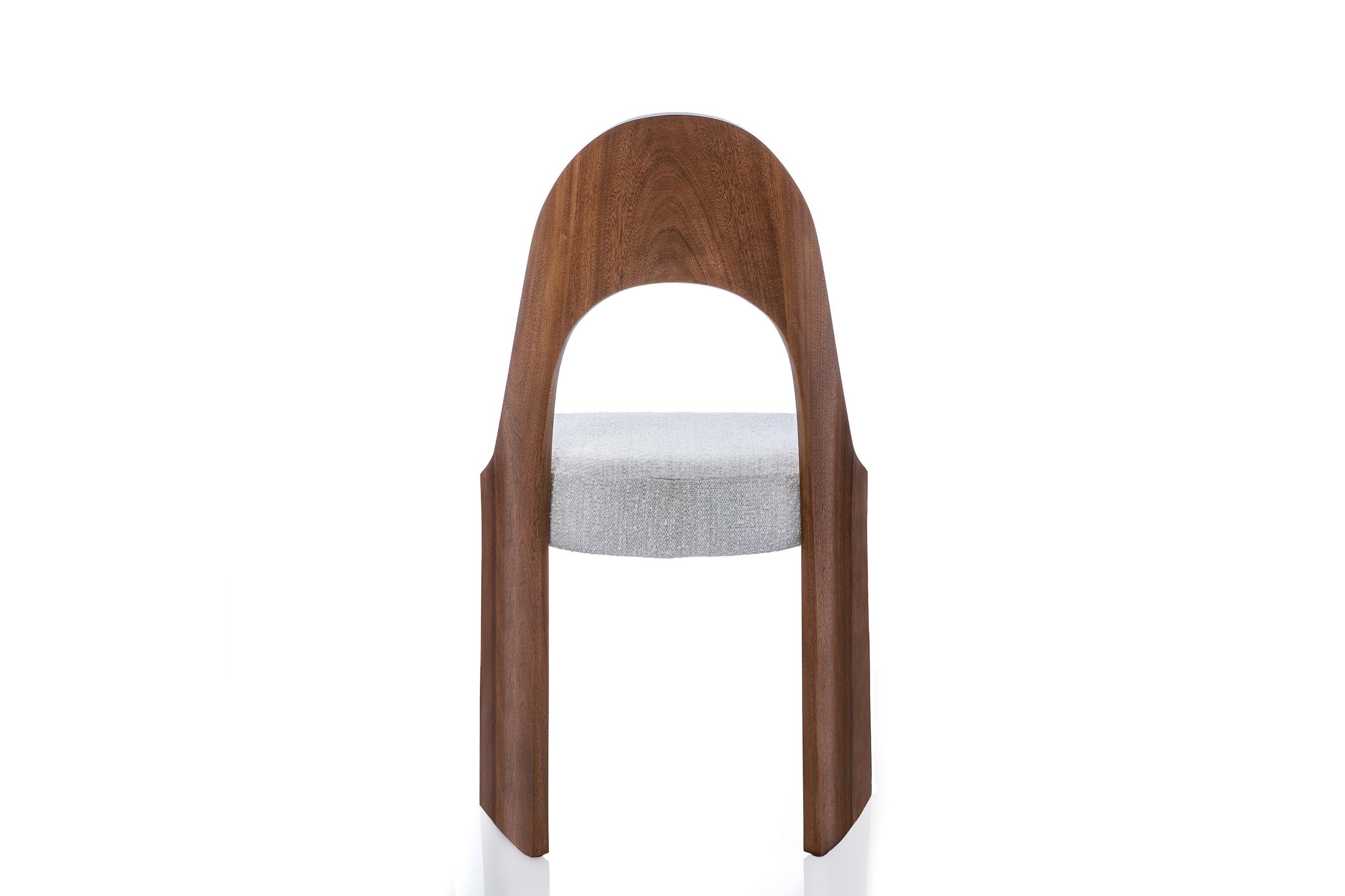 The Gaia chair is ideal as a dining side chair, but could be placed as a “slipper” almost anywhere for a stylish accent or convenient seating. A close look reveals subtle “compound” curves. The arched back, for example, has a gentle slope which runs