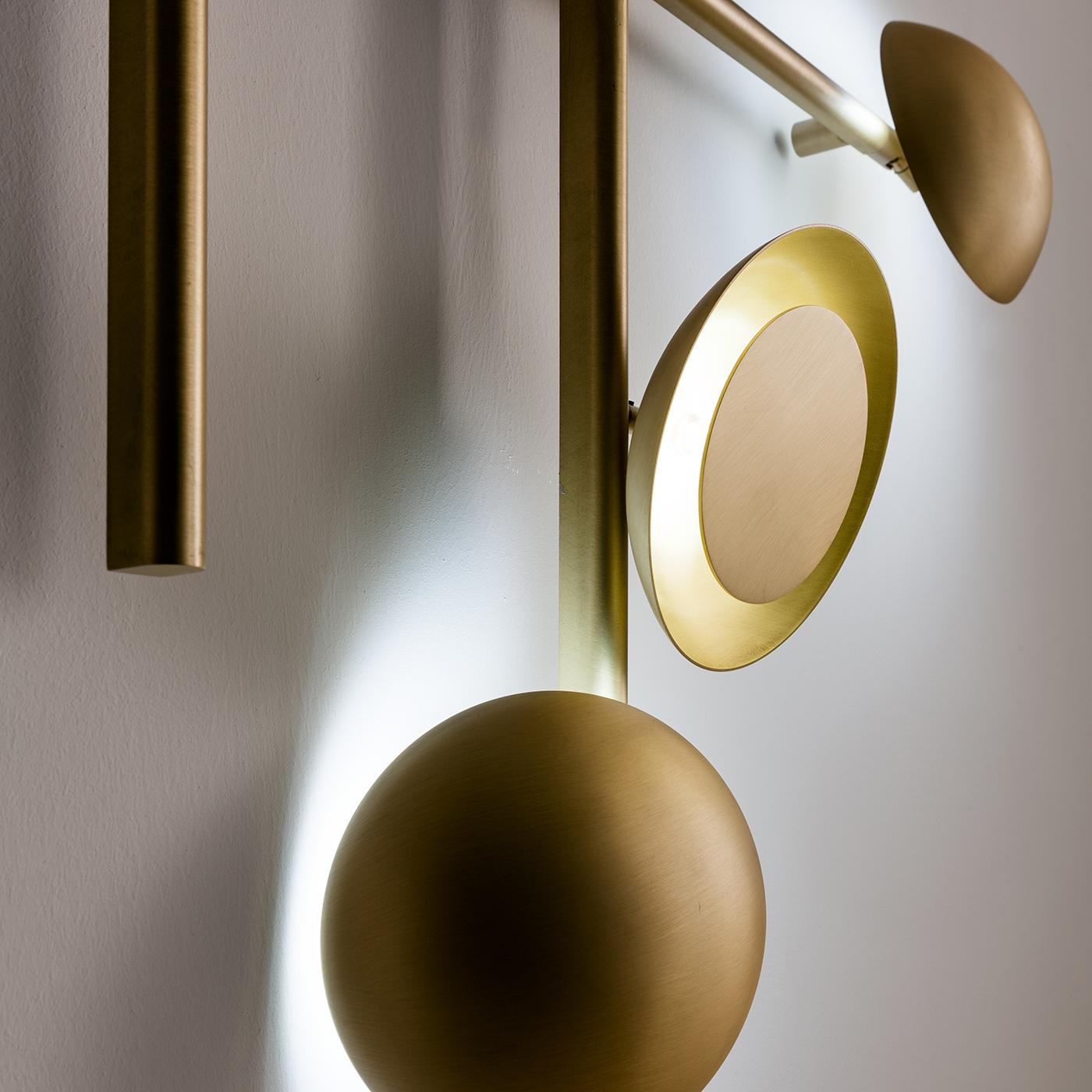 Illumination becomes an original sculpture of geometric forms with this stunning burnished brass wall lamp of the Gaia Collection by Cesare Arosio. Astonishing lighting effects are created by the different configurations of the singular disks