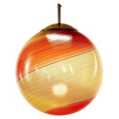 Gaia, Murano-Bernstein und rote Mezza Filigrana-Glaskugel, Silvio Piattelli Design