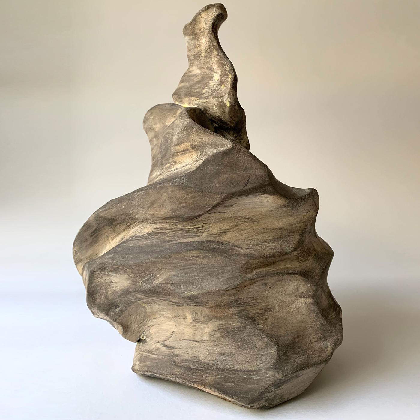 The astonishing Gaia Sculpture is a unique work of art by Silvia Garau who, starting from a single block of clay, worked hard and passionately using spiral-like gestures to obtain this captivating, utterly fascinating shape. Made of black fire-proof