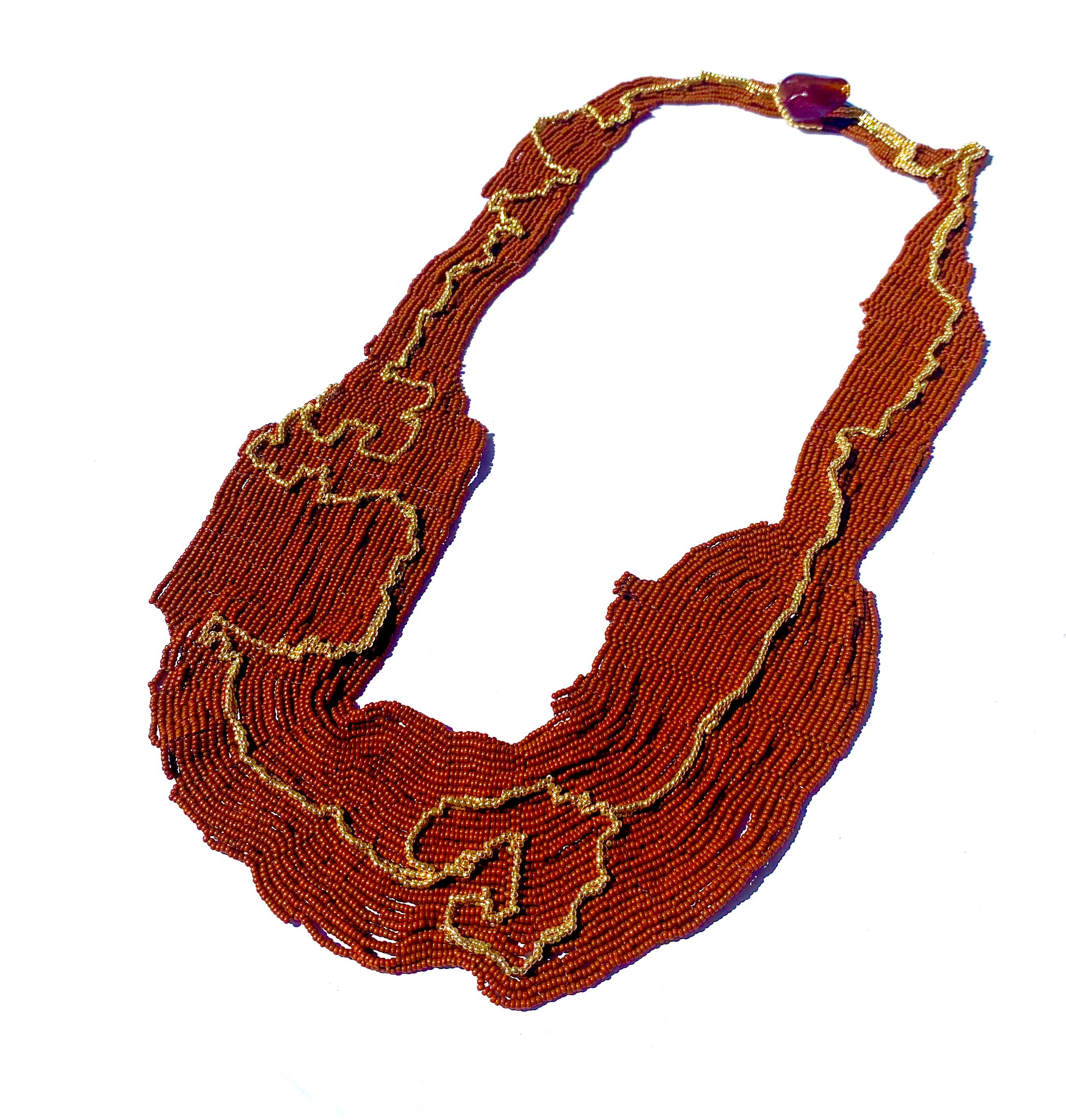Handwoven permanent 14k gold plated seed beads with earthy terracotta brown Japanese glass seed beads woven over the period of 8 weeks in the largest and most significant piece of our catalogue. Gaia's Gold path is inspired on the twists and turns