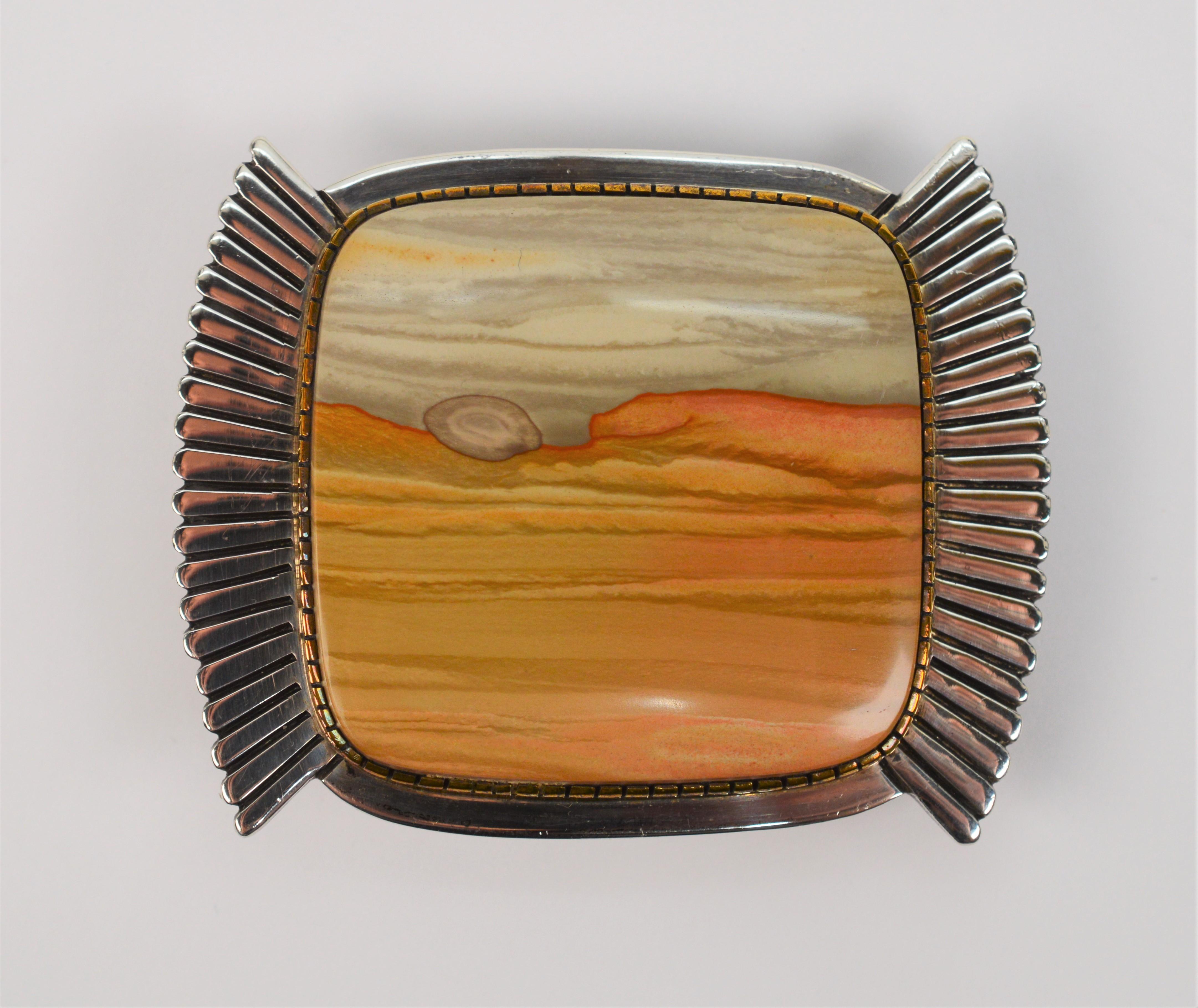 By well known and award wining Native American designers Gail Bird and Yazzie Johnson. Their collaborative designs are notably artful and distinctive and often considered unmatched by others in Native American Jewelry design with work shown in