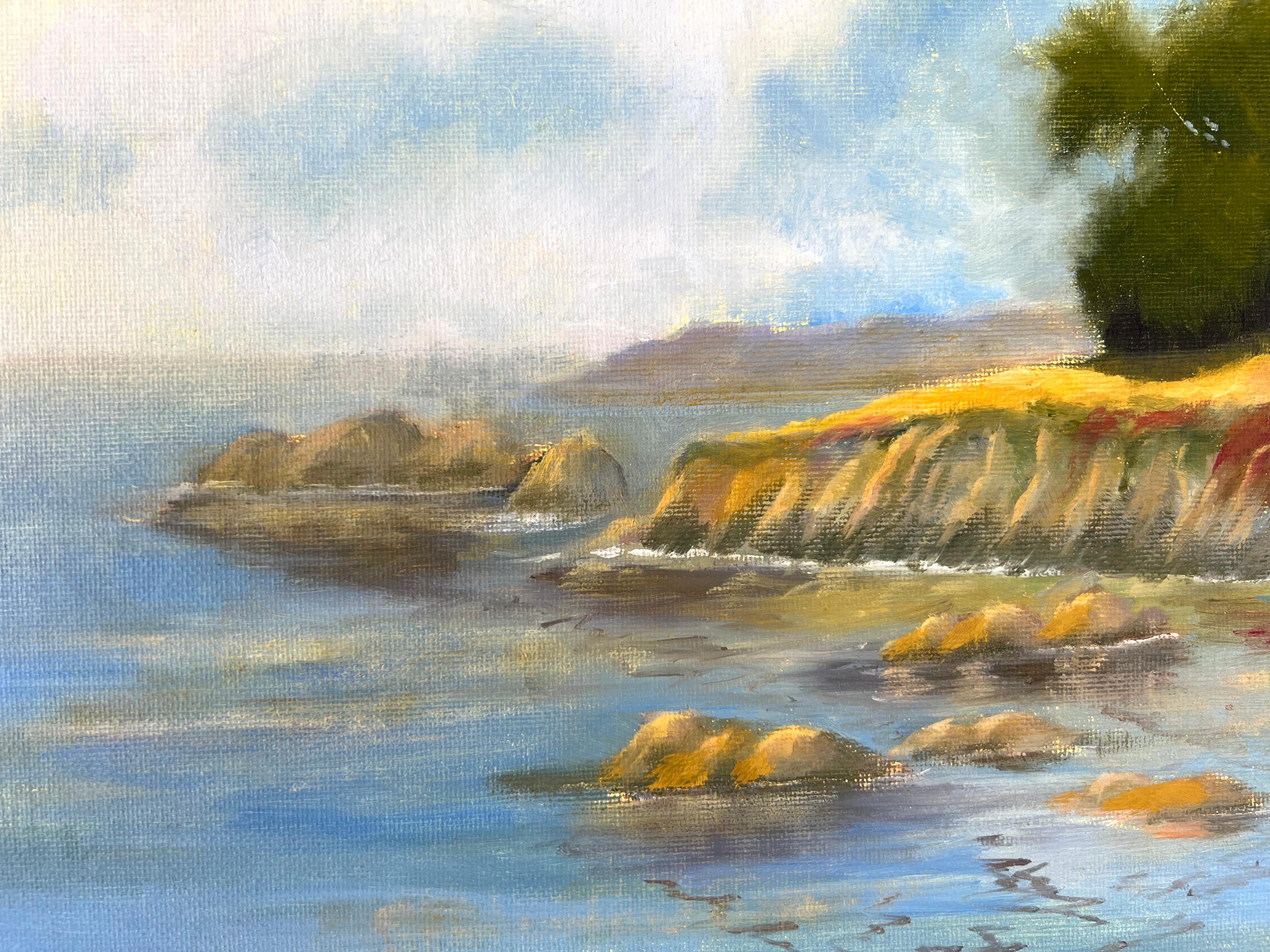 California Coastline by Gail Wilhelm

Serene seascape painting of the California coastline by Novato artist Gail Wilhelm (American, 1938-2018). Hues of blues and browns make up the water with the cliffs casting a shadow below. A vibrant green tree