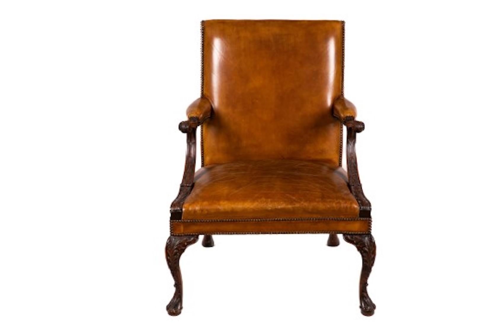 Gainsborough style coulored cognac leather and mahogany armchair with studded leather