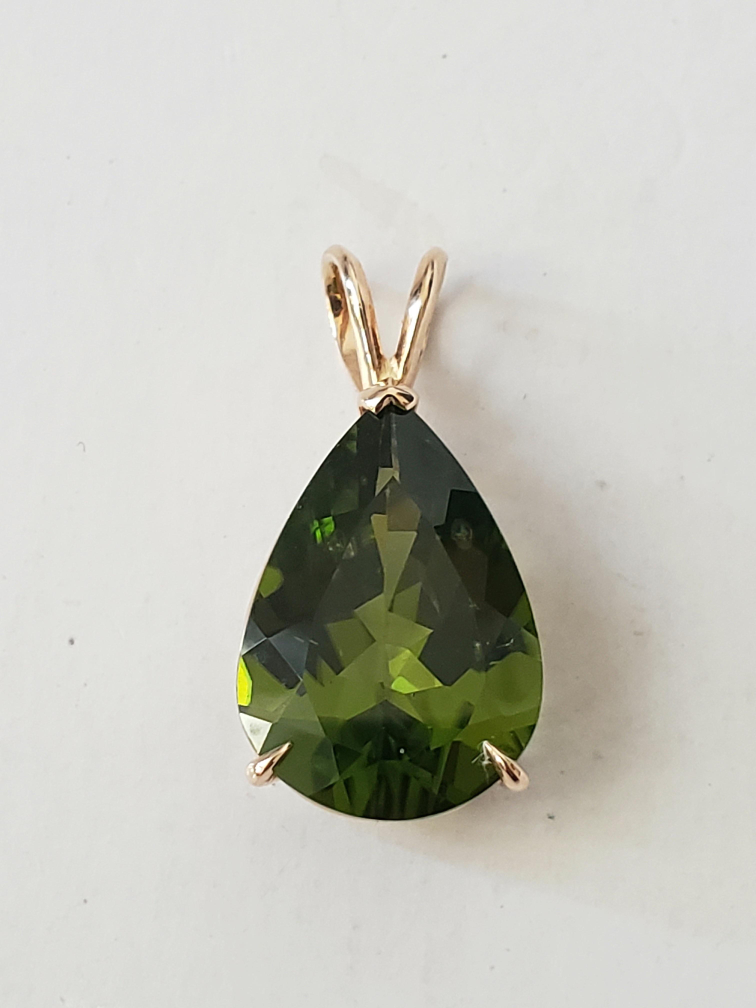 Add a touch of elegance to your outfit with this stunning pear-shaped pendant from LaFrancee. The pendant features a natural, untreated 12.22 ct Burma peridot in a teardrop shape, set in 14k yellow gold. The deep emerald green color of the peridot