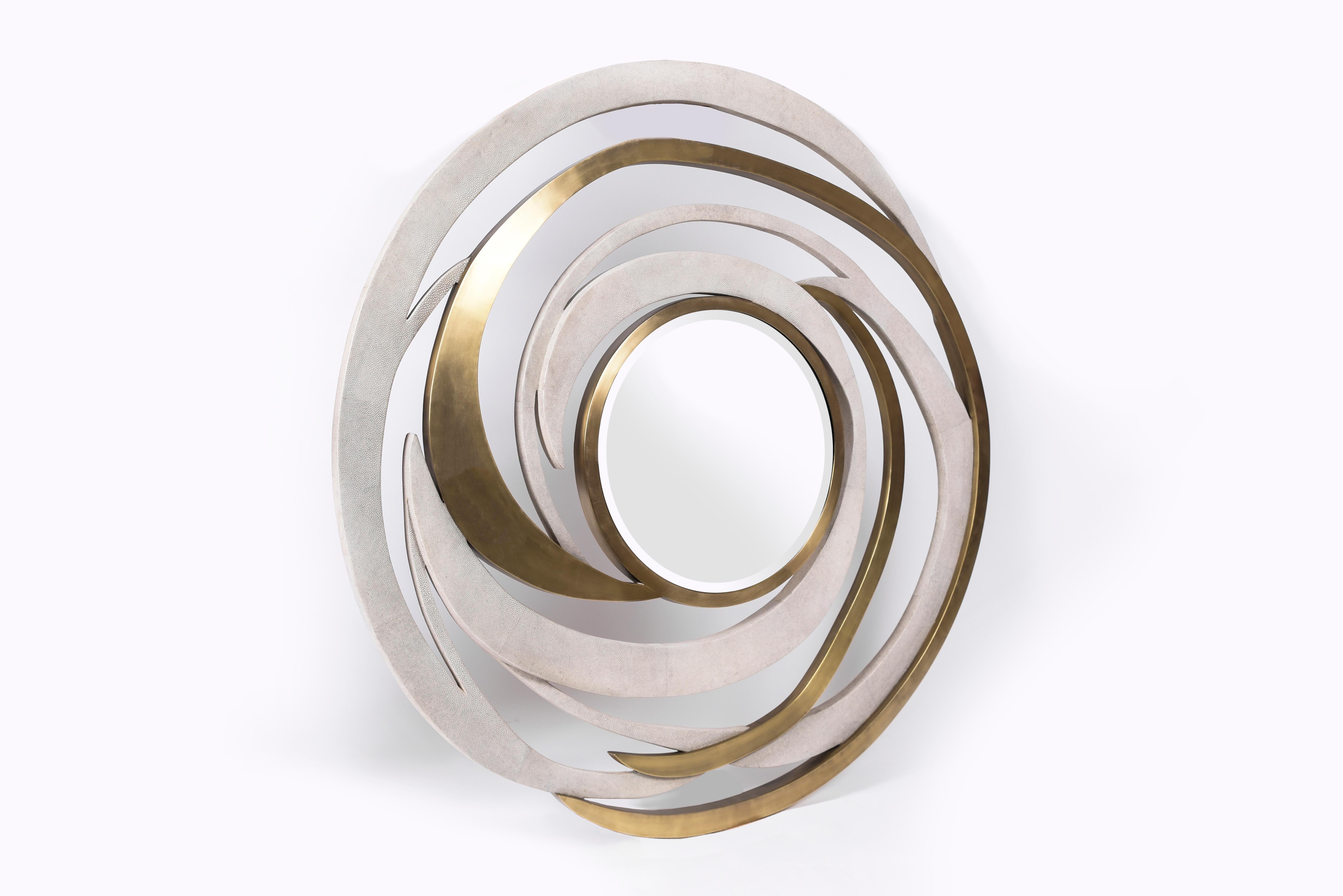 The galactic pattern mirror is a statement piece with its celestial inspired roots. The mixture of cream shagreen and bronze-patina brass on each ring creates a graphic quality to the overall piece, while retaining a whimsical feel. The shagreen is