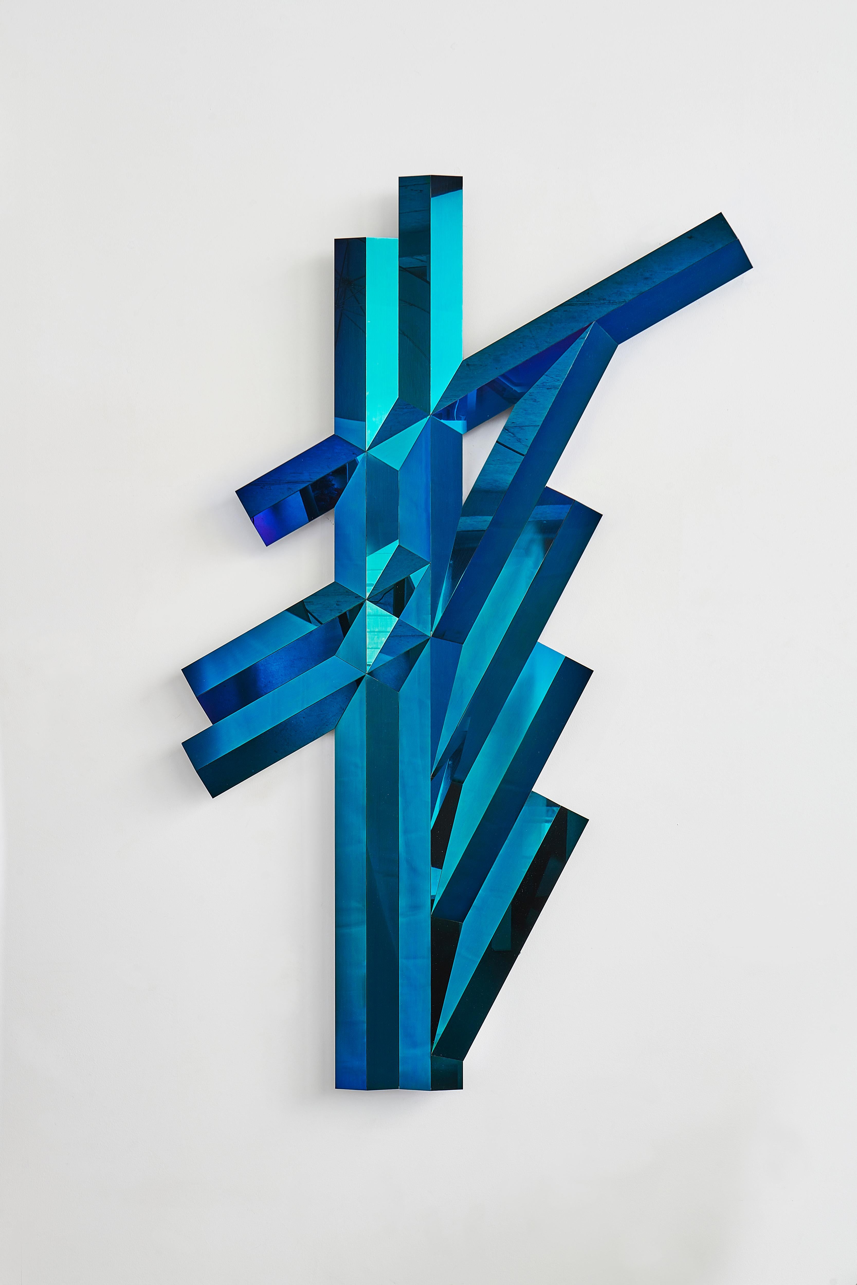 Galactica I Blue Mirror Sculpture by SB26
Dimensions: W 92 x D 10 x H 148 cm
Materials: Stainless Steel, Blue Finishing.

Galactica is a visual vocabulary, inspired by both retro-futurism and architecture, developed by Samuel. Wall sculptures and