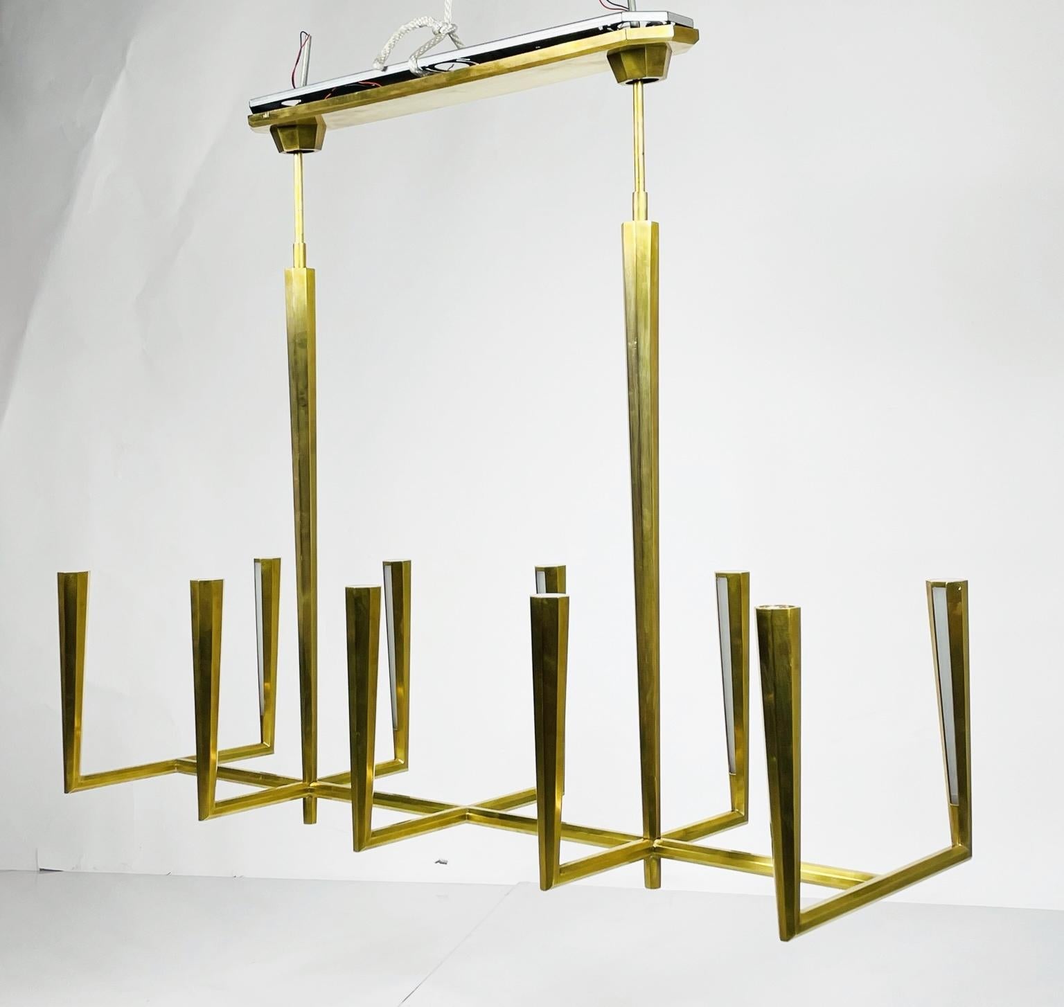 Eye-catching sleek metal lines define the Galahad by Thomas O'Brien. The minimalist aesthetic is at once modern and timeless.
Crafted from solid sculpted and welded brass, the refined fixtures will add a soft glow to rooms.

Measurements:
39.50