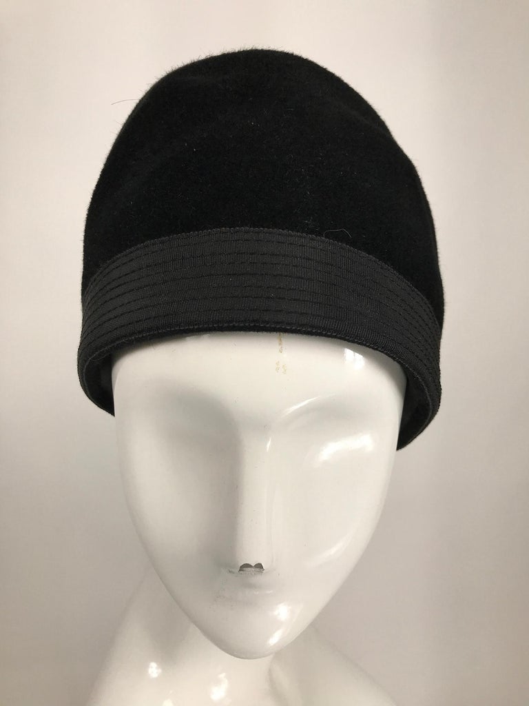 Galanos black fur felt shaped turban hat from the 1960s. The hat has a wide top stitched grosgrain band. It is unlined. In very good condition, with little wear. From the estate of Betsy Kaiser, Vogue cover model and friend of James Galanos