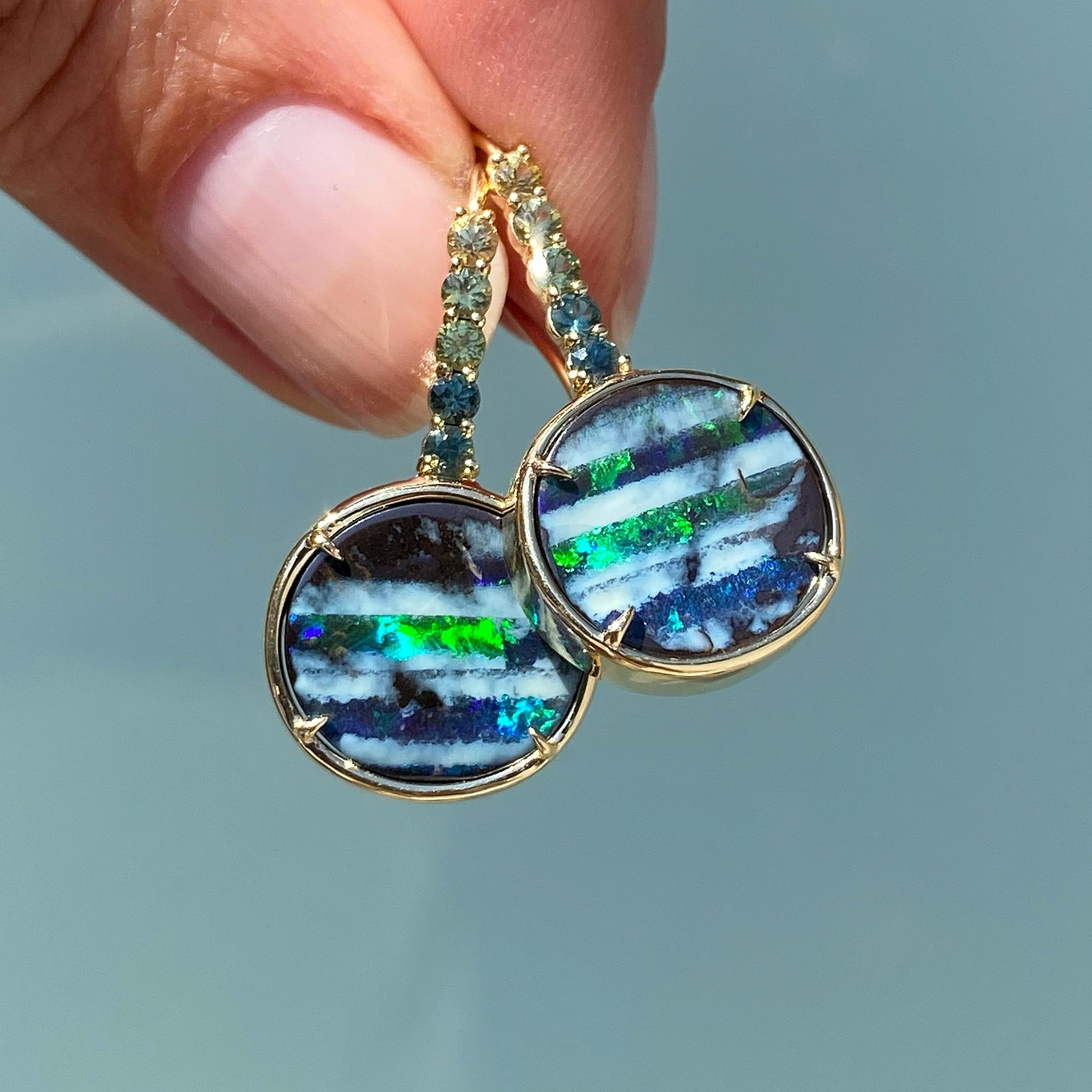 Two spectacular Australian Boulder Opals make an impression in the Galapagos Green Sapphire Opal Drop Earrings. Inspired by the legendary archipelago, these Australian opal earrings reflect the dark volcanic terrain, the white sand beaches, rolling