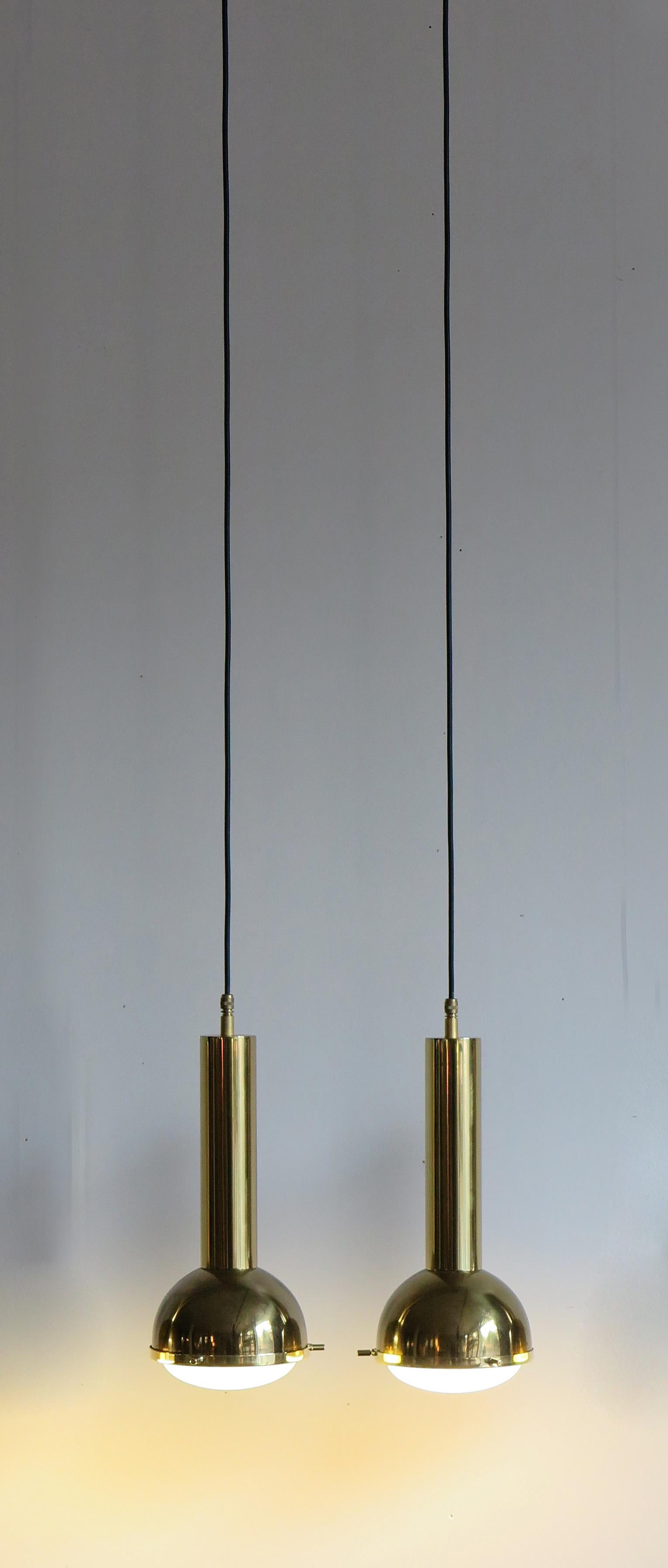 A set of Italian brass and glass pendant lamps produced by Galassia, 1950s

Please note that the lamps are original of the period and this shows normal signs of age and use.