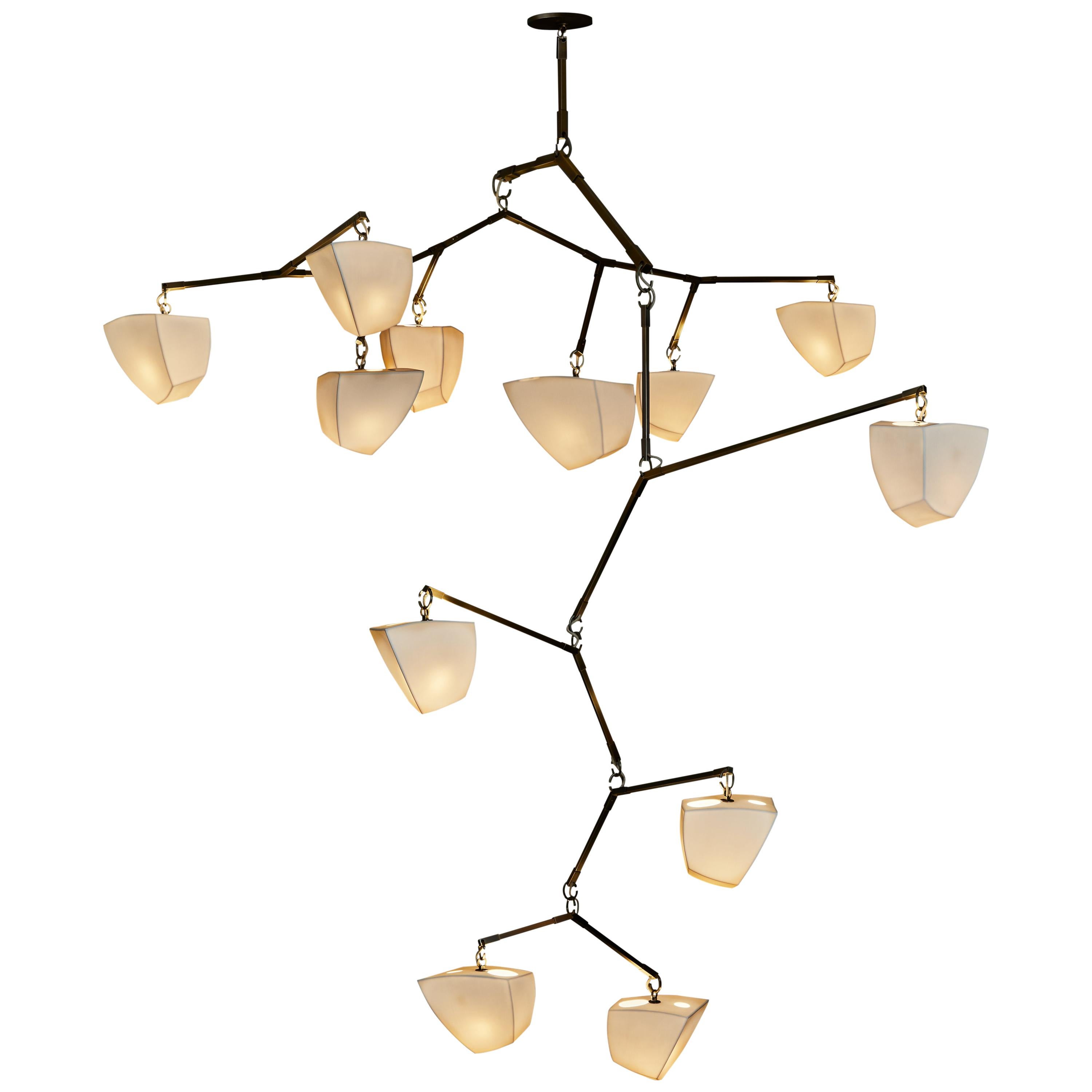 Galaxy 12: Porcelain Mobile Chandelier is a large mobile chandelier with twelve handmade translucent porcelain polyhedron shades in 2 sizes. 

This configuration was designed to float horizontally and vertically extending in two directions and
