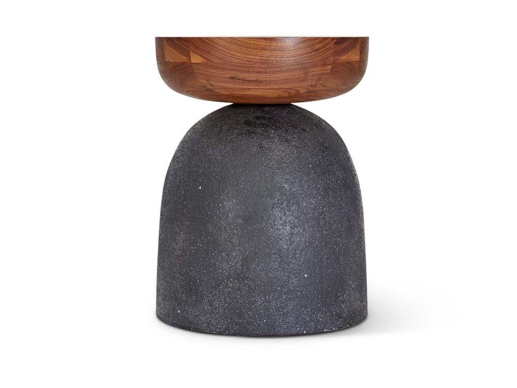 The Galaxy Glaze Side Table features a walnut top and handmade ceramic base by artist Natan Moss.