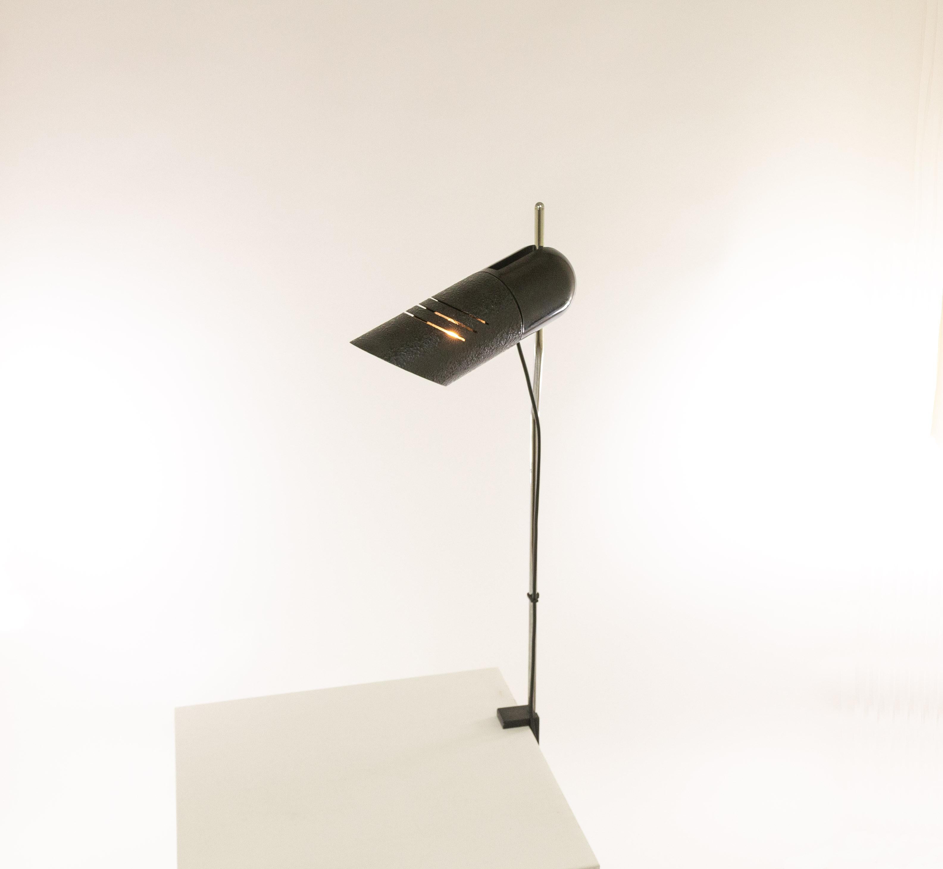 Adjustable table lamp Galdino by Carlo Urbinati for Harvey Guzzini, 1972.

Galdino has been produced in various versions, as a table lamp, wall lamp and as a floor lamp (with one and with two spots). This is the rare clamp lamp which can by