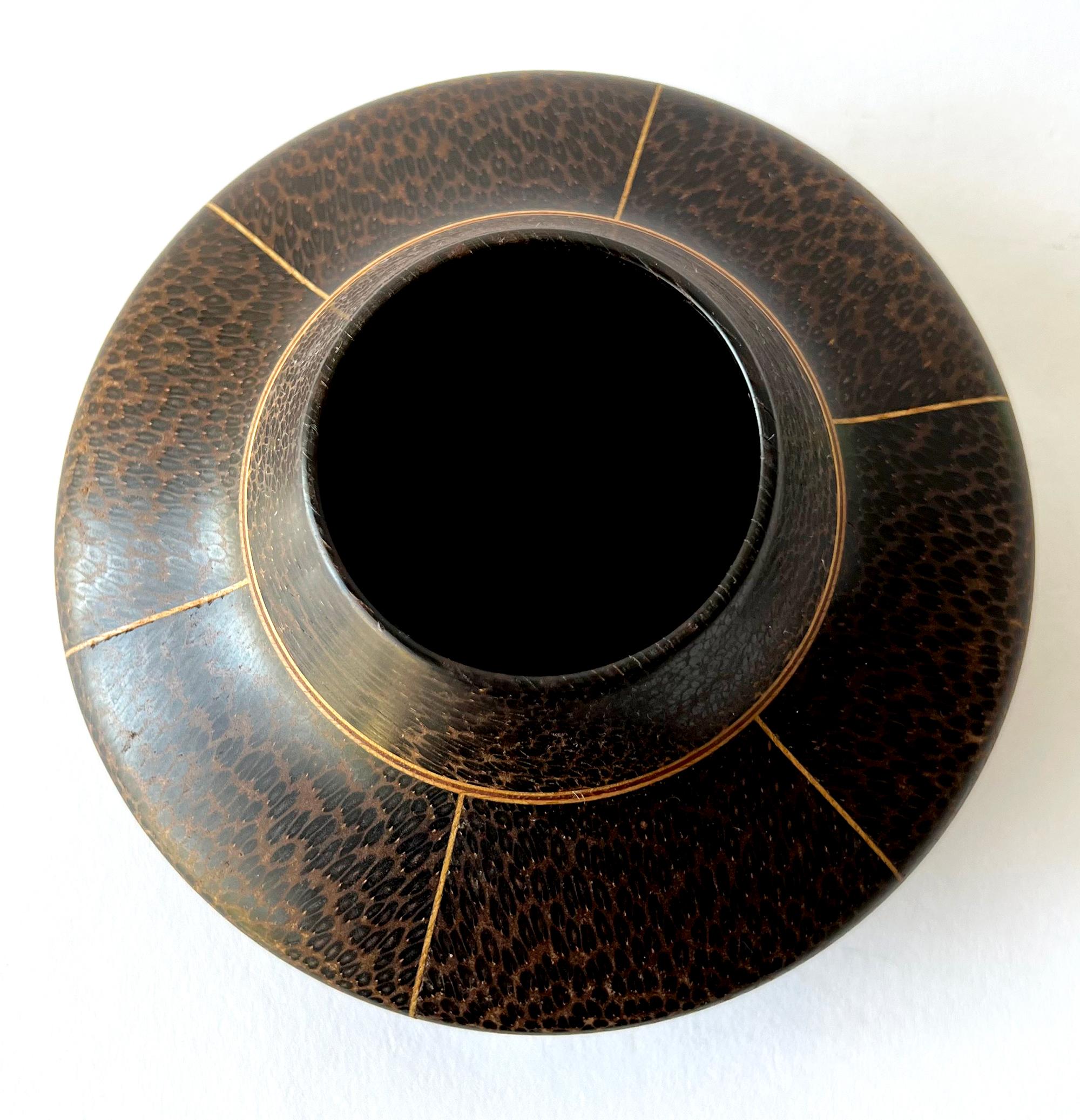 Hand turned black palm and maple vase created by Galen Carpenter, circa 1980s. Vase measures 3.75