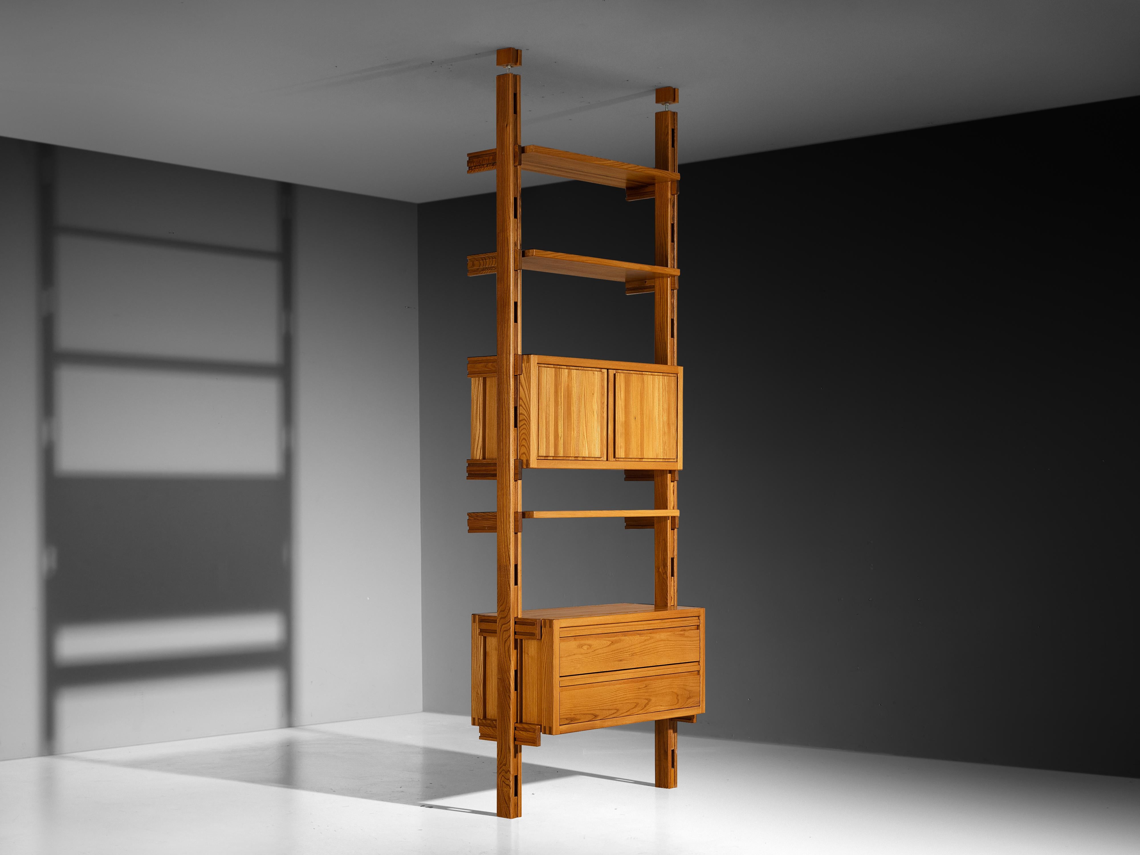 Galerie l'Orme, modular wall unit or room divider, solid elm, France, 1970s. 

Modular wall unit or room divider manufactured by Galerie l'Orme in Paris. Executed in solid elm, this piece exhibits a sturdy wooden frame with a dynamic grain pattern