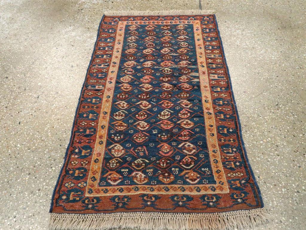This Early 20th century Central Asian Soumak rug, measuring 1' 11