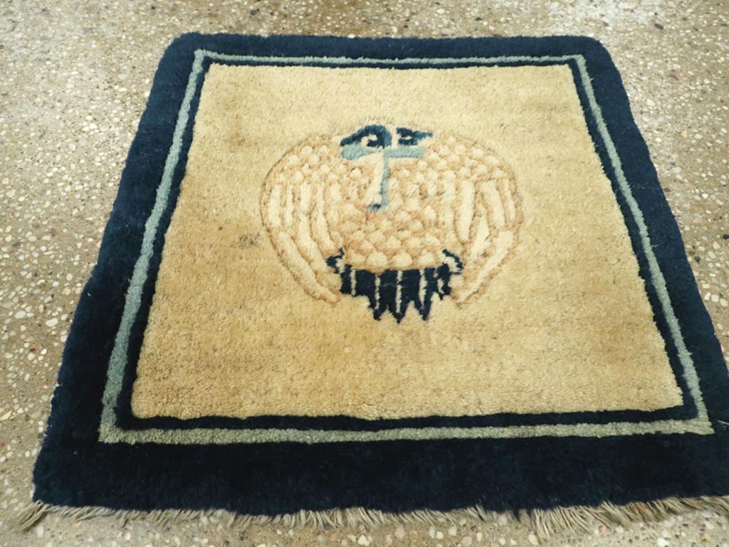 This Early 20th century Chinese Peking rug, measuring 1' 5