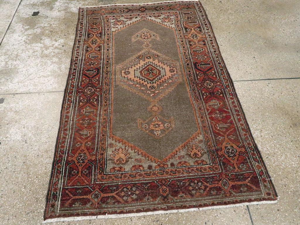 This early 20th century Persian Kurdish rug, measuring 3' 5