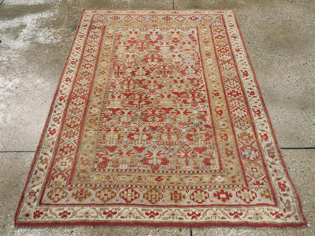 This Early 20th century Persian Kurdish rug, measuring 4' 0