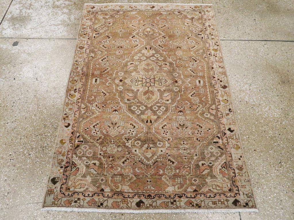 This early 20th century Persian Malayer rug, measuring 3' 1