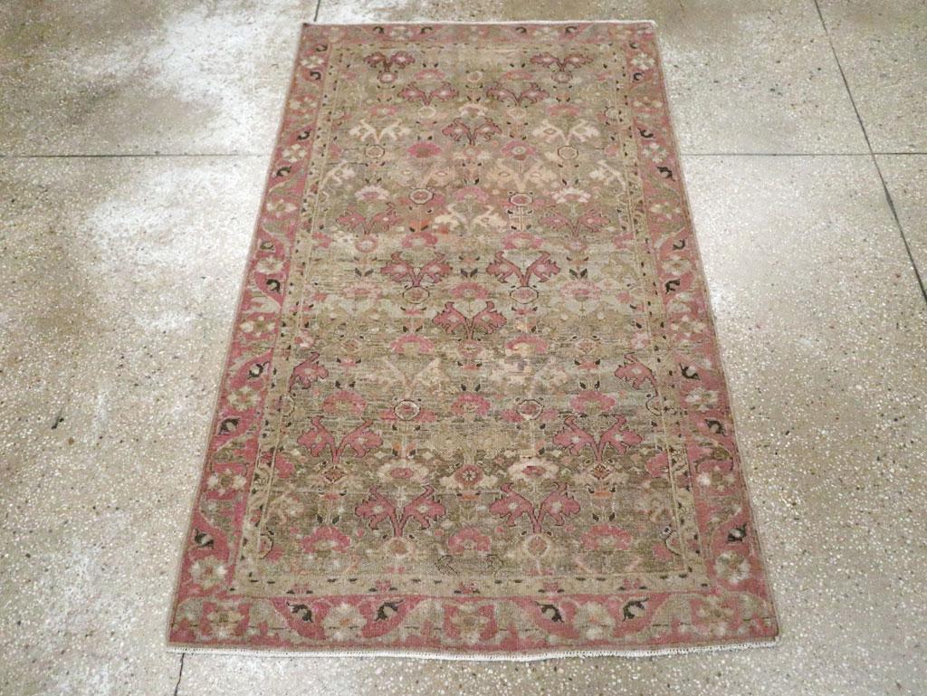 This early 20th century Persian Malayer rug, measuring 3' 4
