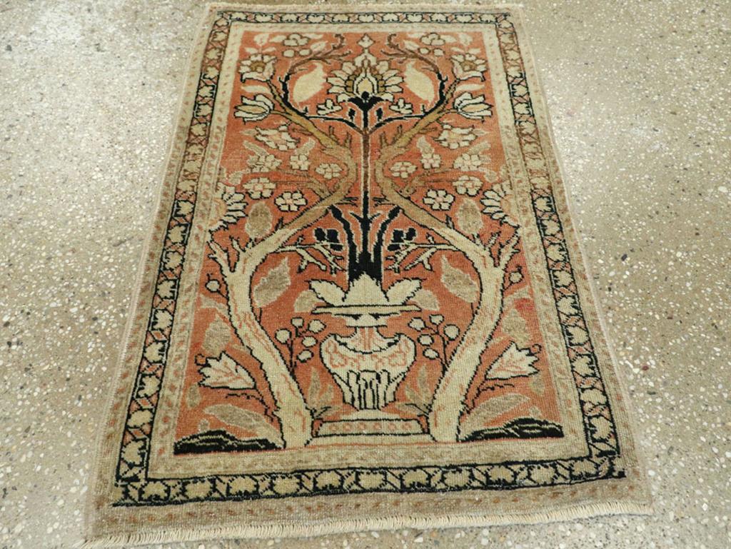 This early 20th-century Persian Tabriz Haji Jalili rug, measuring 1'9