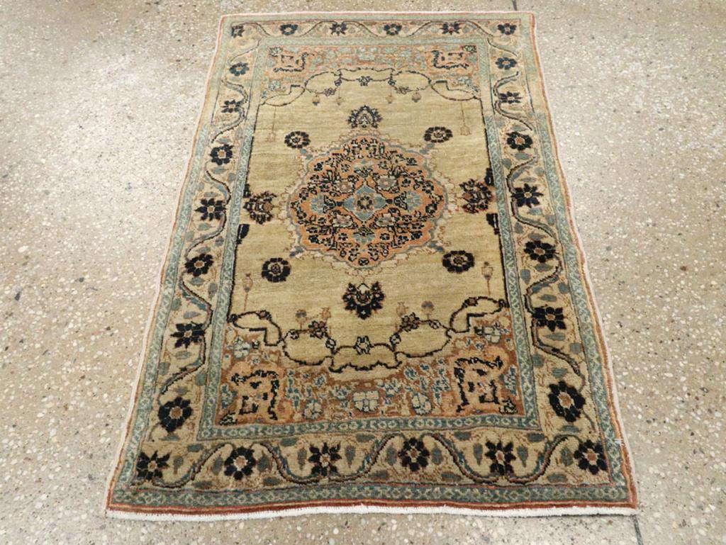 This early 20th-century Persian Tabriz Haji Jalili rug, measuring 1'9