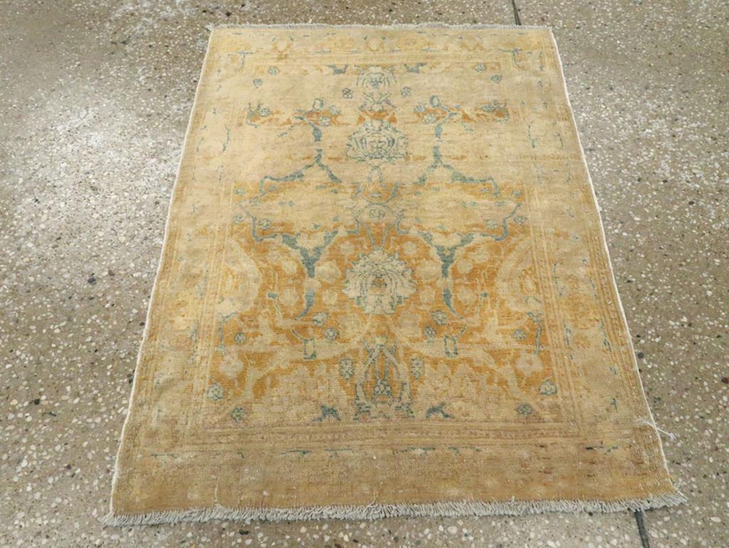 This early 20th-century Persian Tabriz Haji Jalili rug, measuring 1'10