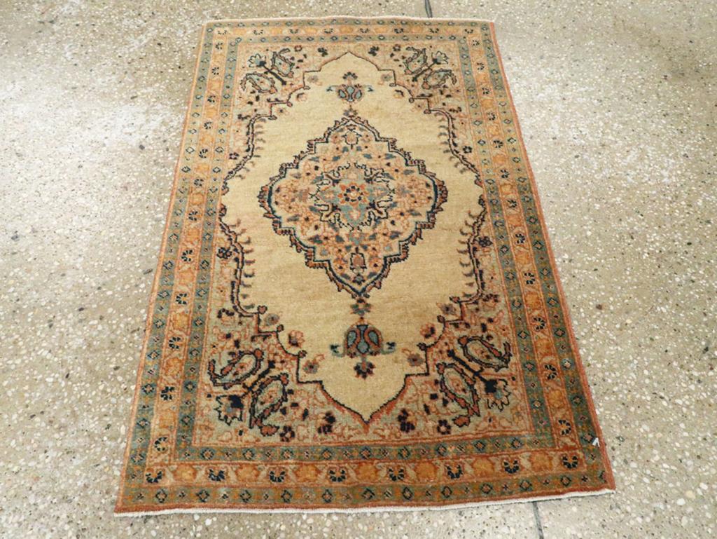 This early 20th-century Persian Tabriz Haji Jalili rug, measuring 1'8