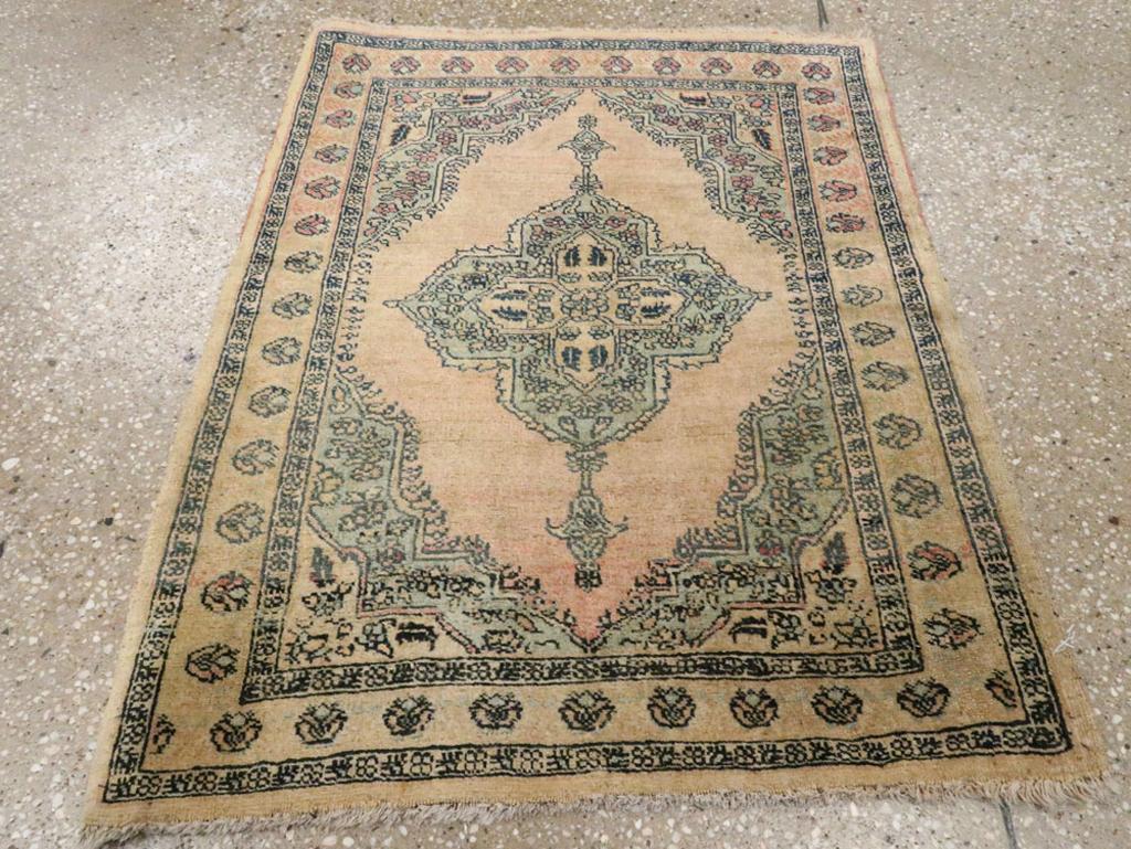 This early 20th-century Persian Tabriz Haji Jalili rug, measuring 2'1