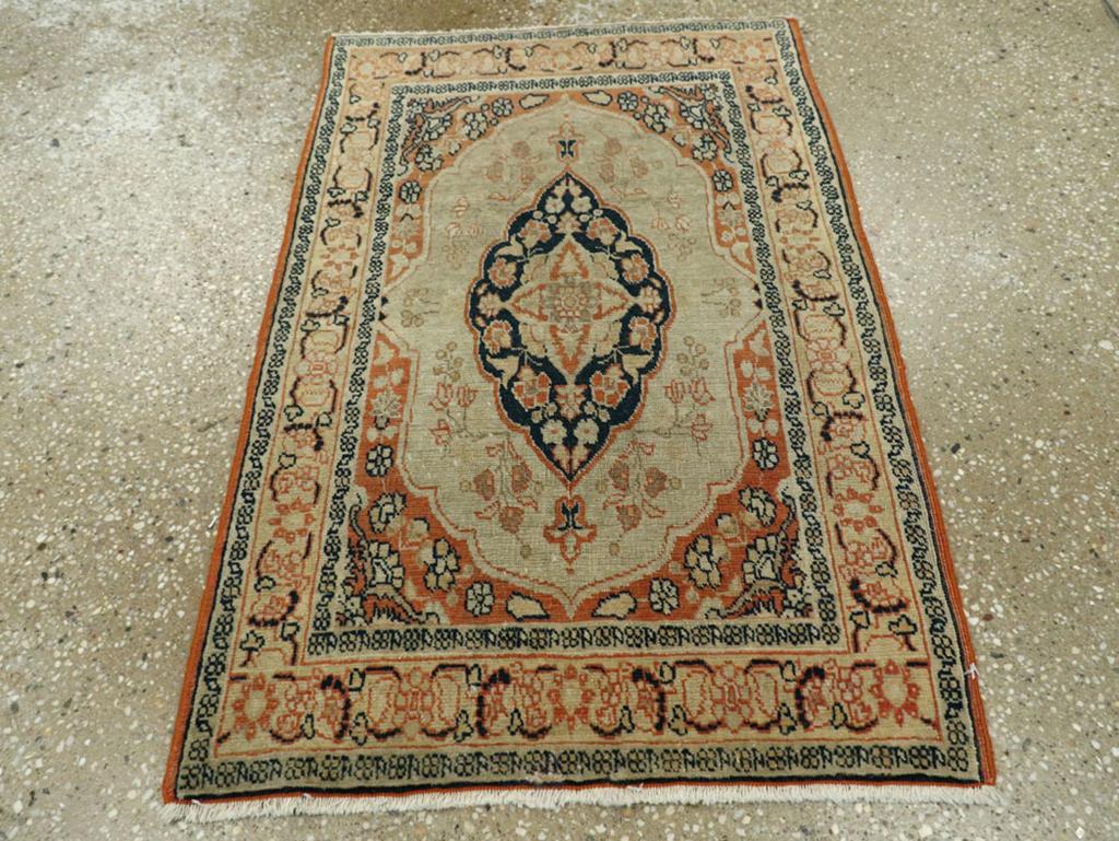 This early 20th-century Persian Tabriz Haji Jalili rug, measuring 1'10